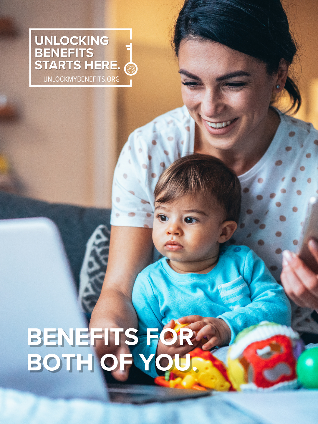 A woman and child are smiling while using a laptop, promoting benefits through unlockmybenefits.org.