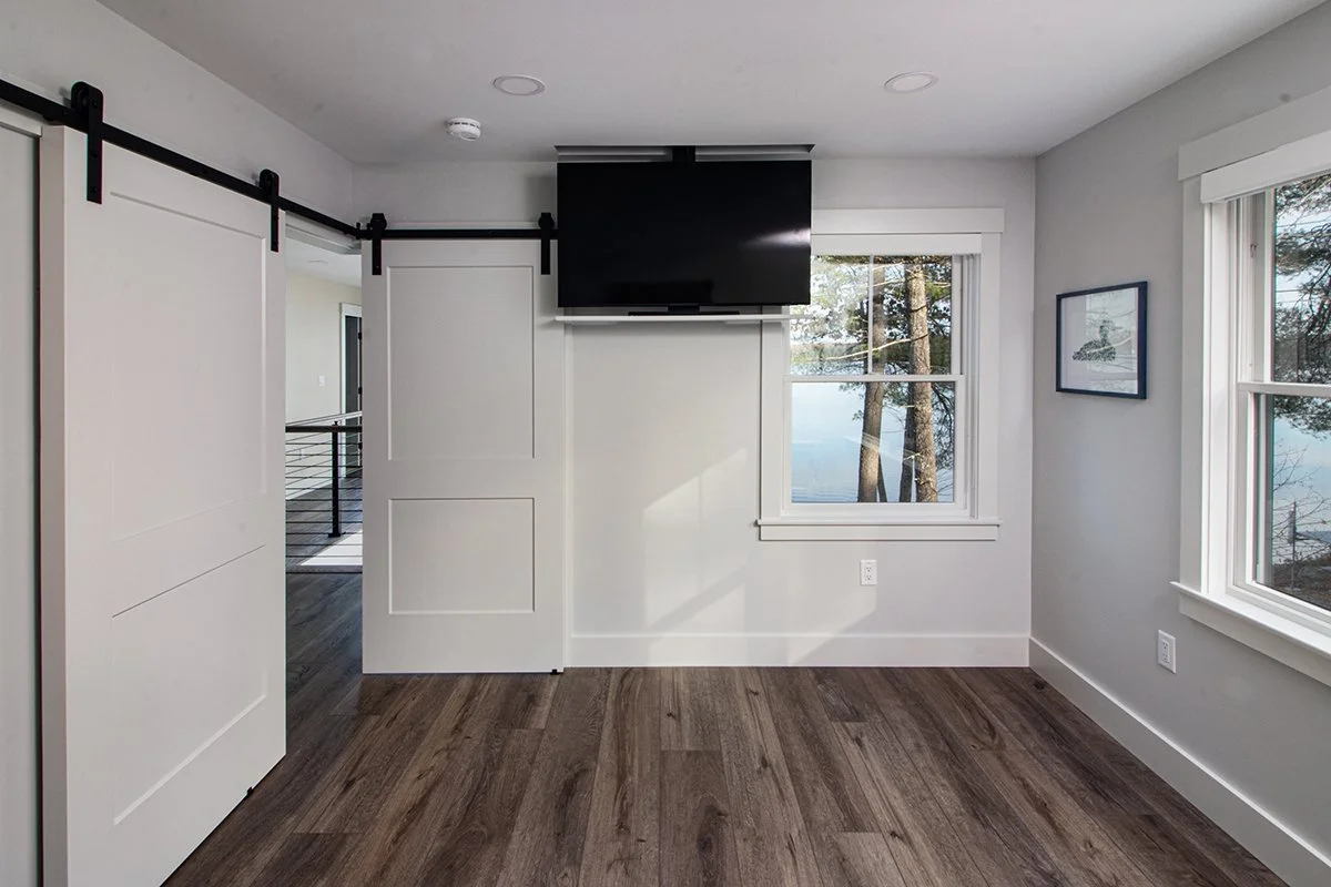 Interior-Design-Newburyport-Modern-Lakehouse-Bedroom-with-TV.jpg