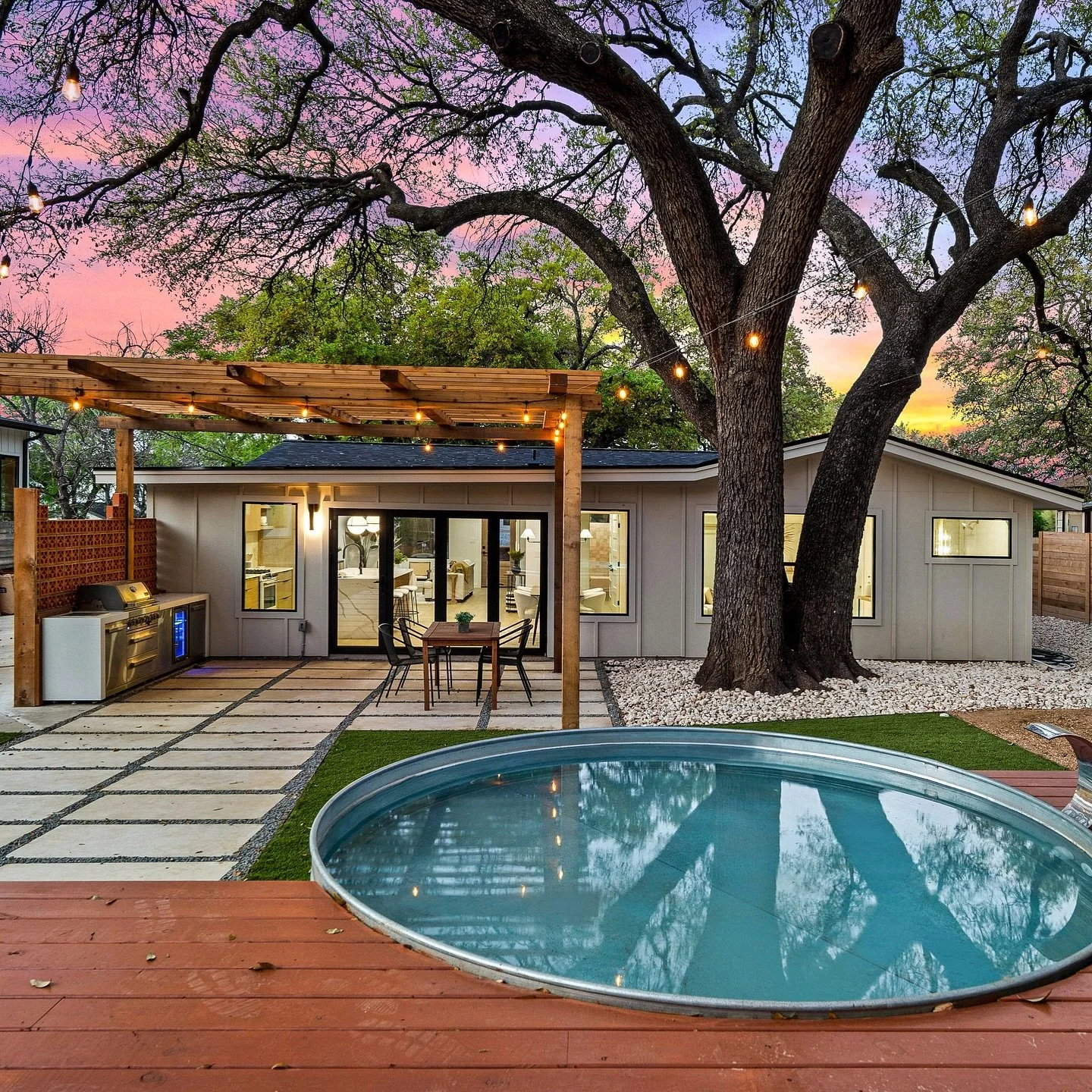 Outdoor living goals! 🌿✨ This backyard transformation is all about blending relaxation and functionality. From the pergola-covered dining space and outdoor kitchen to the serene cowboy pool, this setup is perfect for entertaining or unwinding under 