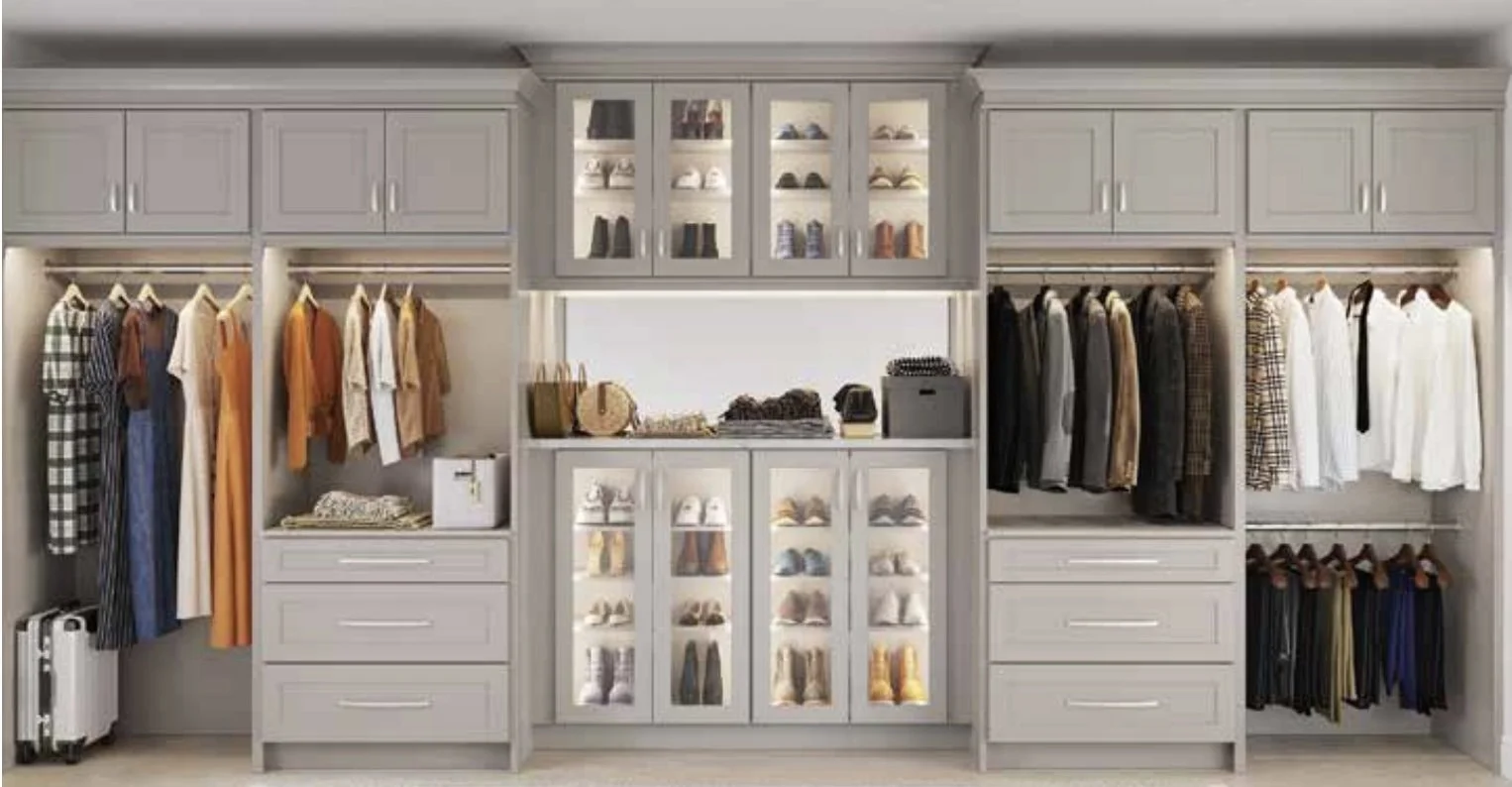 Organized walk-in closet with clothing, shoes, and accessories. Built with NorthPoint cabinets