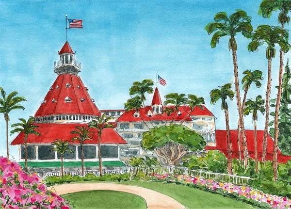 A large building with a red, round, cone-shaped roof and flag on top, surrounded by palm trees and flower bushes, under a blue sky.
