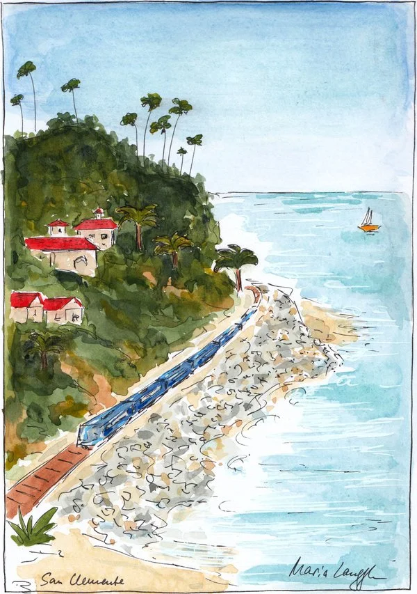 San Clemente. A watercolor painting of a coastal scene with a train running along a rocky shoreline, green hills with houses and palm trees, and the ocean with a sailboat in the distance.