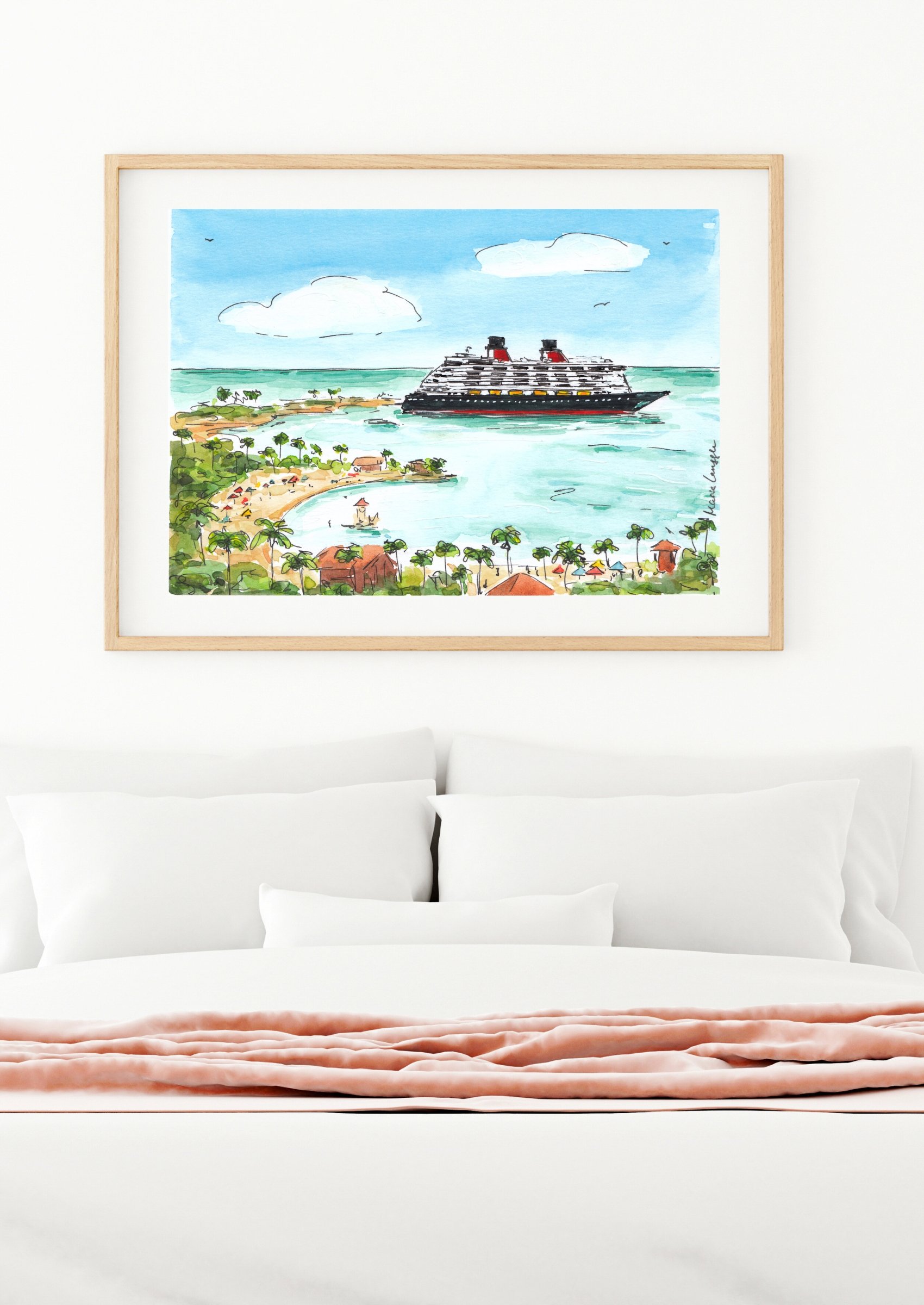 Watercolor painting of a cruise ship on the ocean near a tropical shoreline with palm trees and small buildings, framed and hung on a white wall above a bed with white pillows and a soft pink blanket.