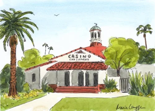 A watercolor painting of the Casino San Clemete surrounded by tall palm trees and lush greenery, with a pathway leading to the entrance.