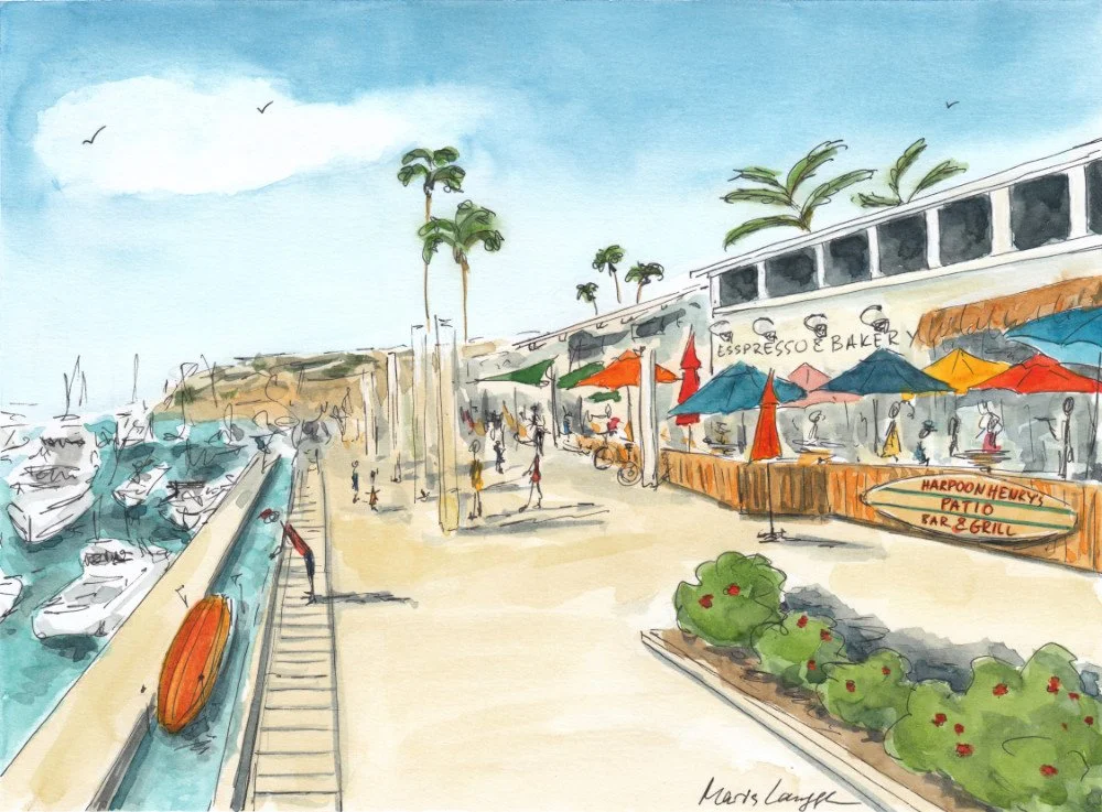 A seaside scene with boats docked along the left, a pathway with people on the right, and outdoor cafes with colorful umbrellas. Palm trees and a building with signage for a bakery and bar are visible, with a clear blue sky overhead.