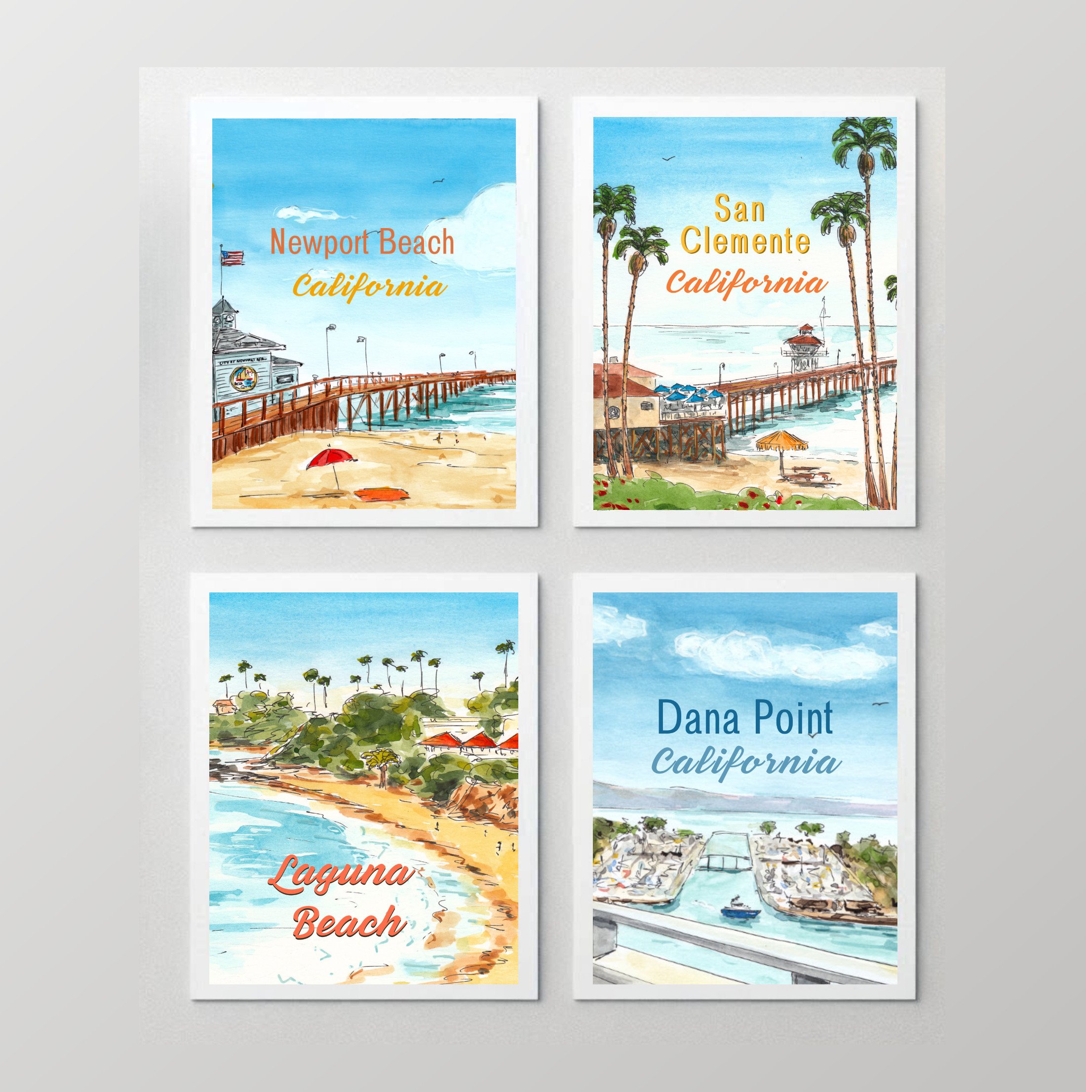 Set of four watercolor-style posters of California beaches and coastal scenes, including Newport Beach, San Clemente, Laguna Beach, and Dana Point.