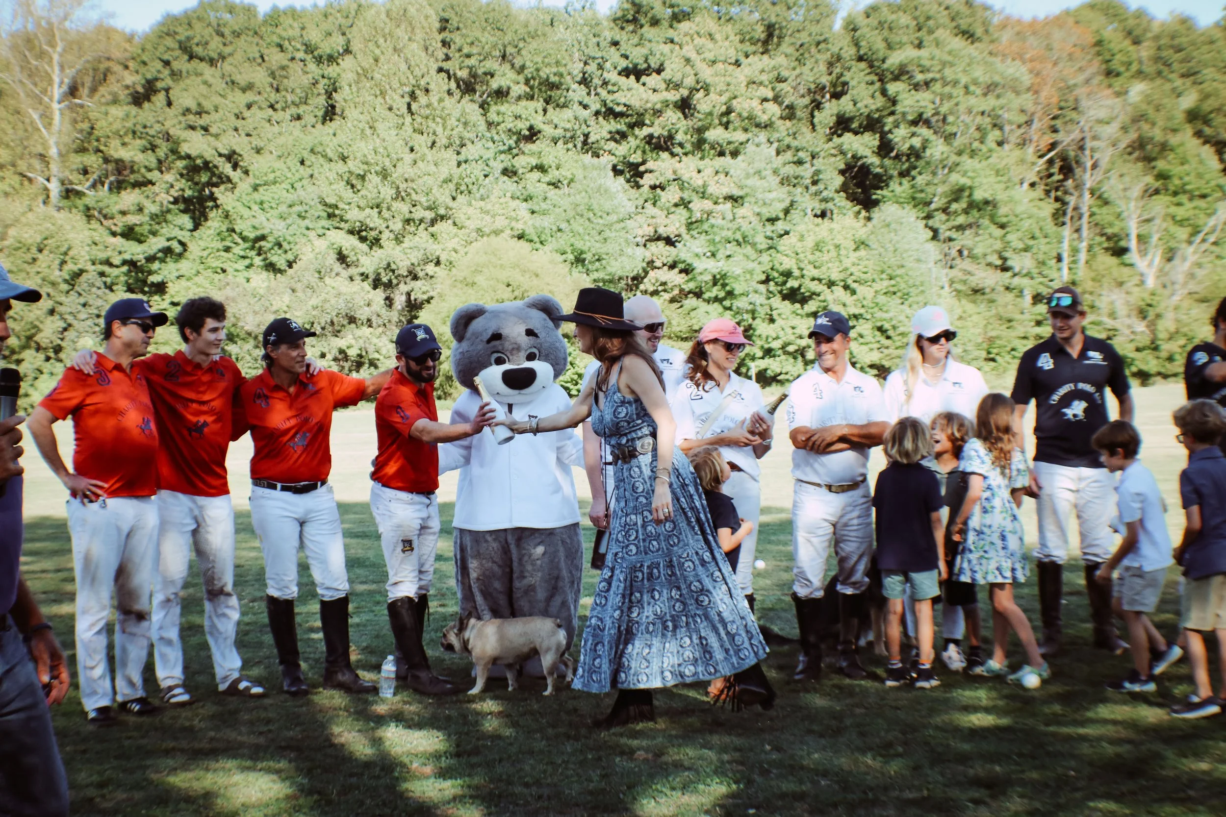 A member of the Founders Auxiliary congratulates players post-match at the 2025 Charity Polo Cup.