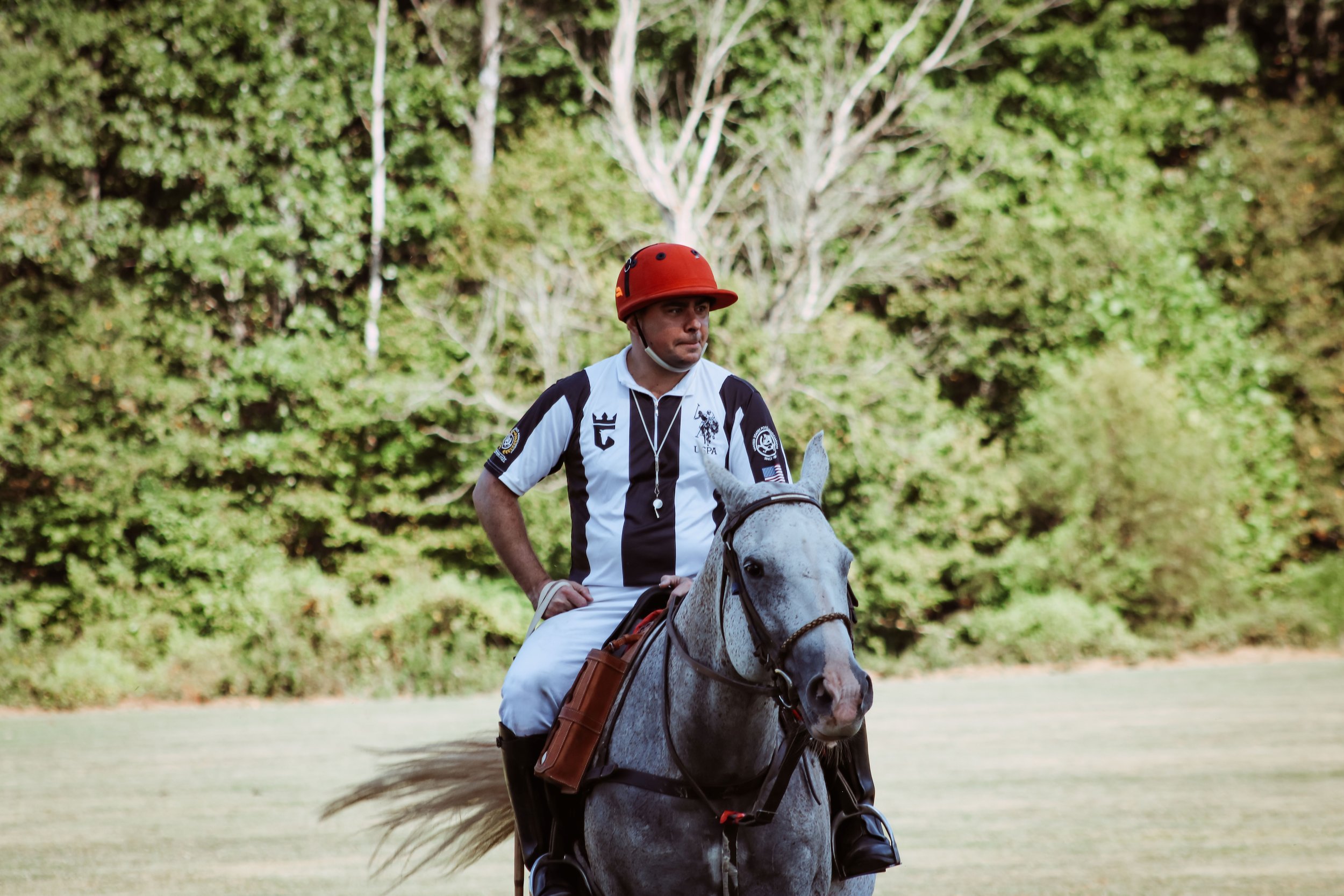 A polo player on horseback at the 2025 Charity Polo Cup.