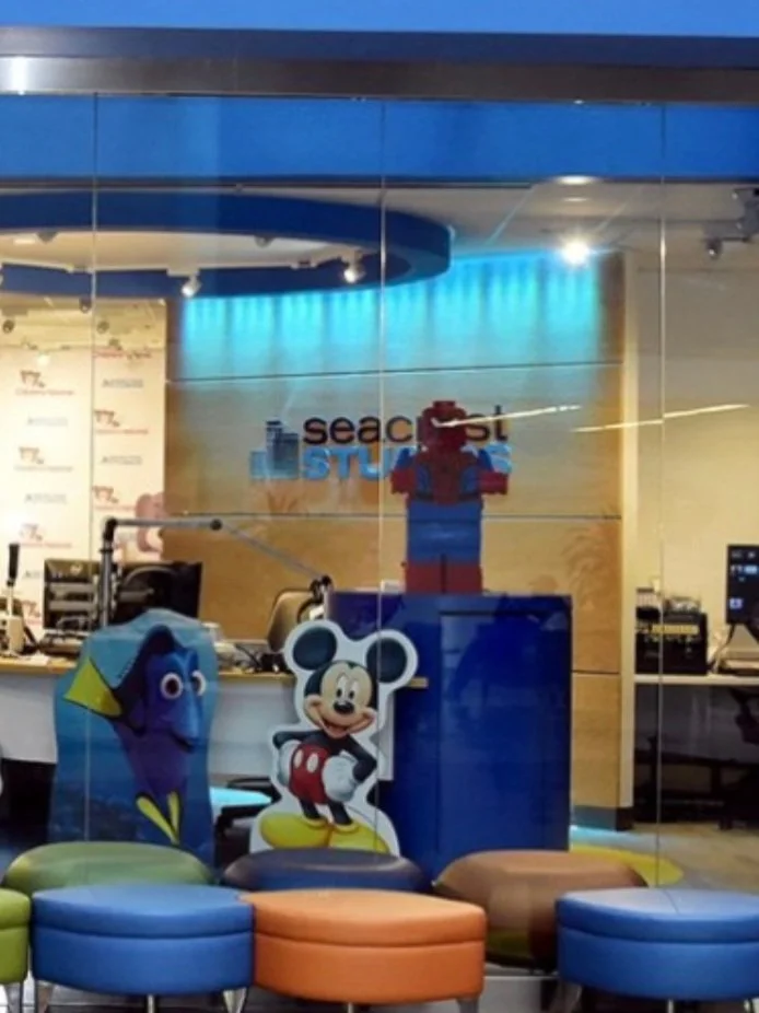 A photo of the Seacrest Studios as seen through a large glass window
