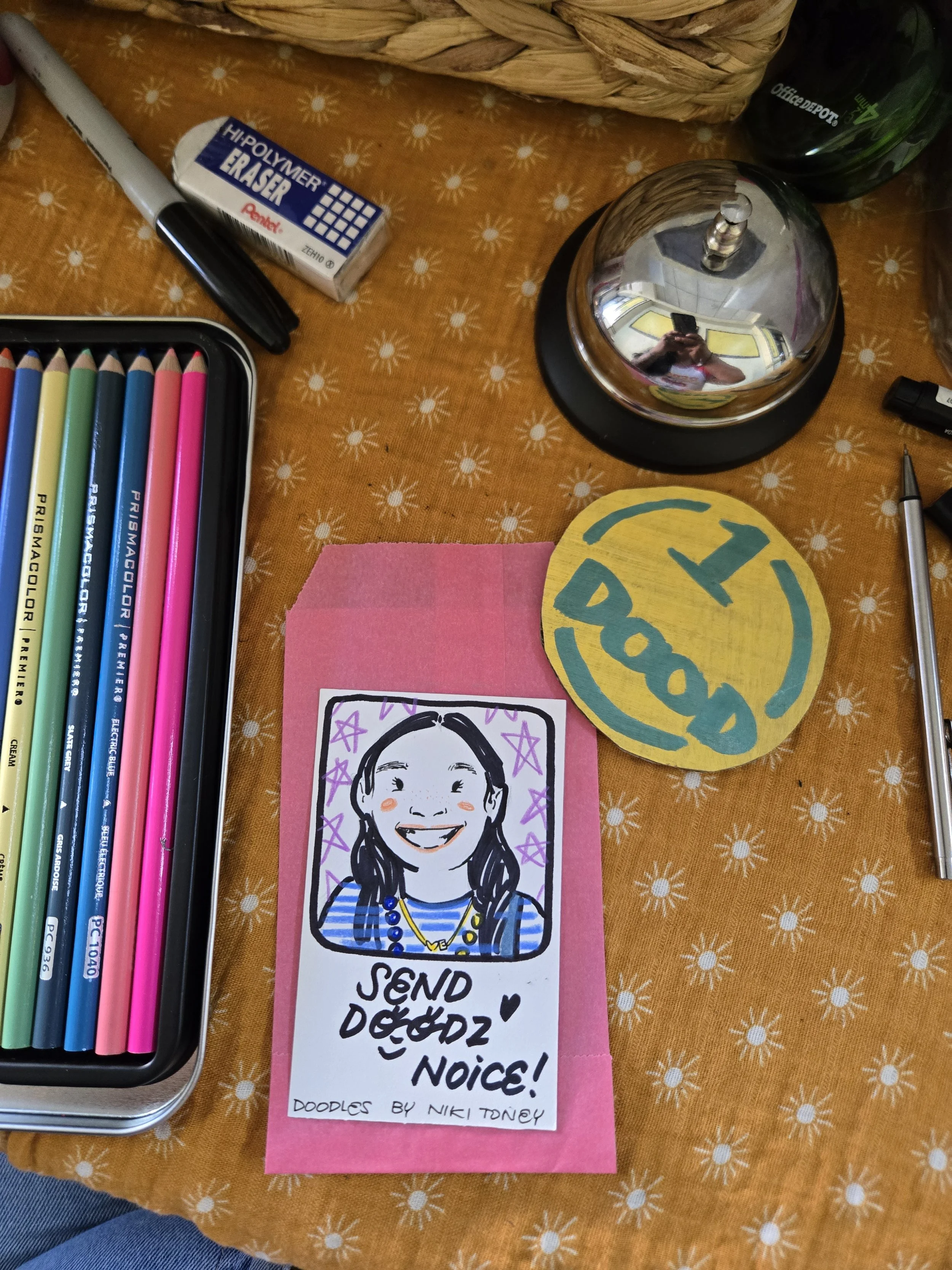 Colorful sketch of a smiling girl, artwork by Niki Toney, positioned on a pink paper note with handwritten text that says 'Send Doodz!'