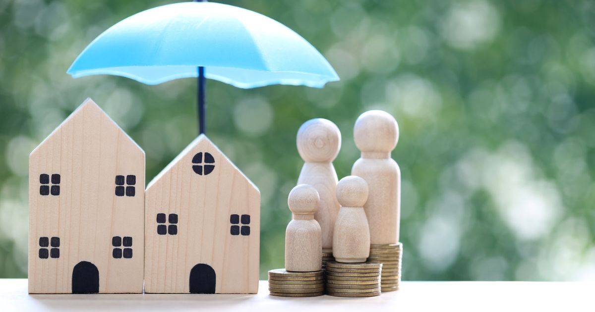 Family insurance protection concept with house, coins, and umbrella
