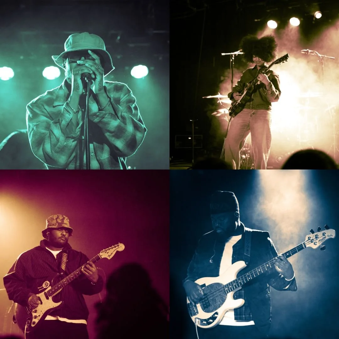Four musicians performing on stage with colorful stage lighting, each playing a different instrument.