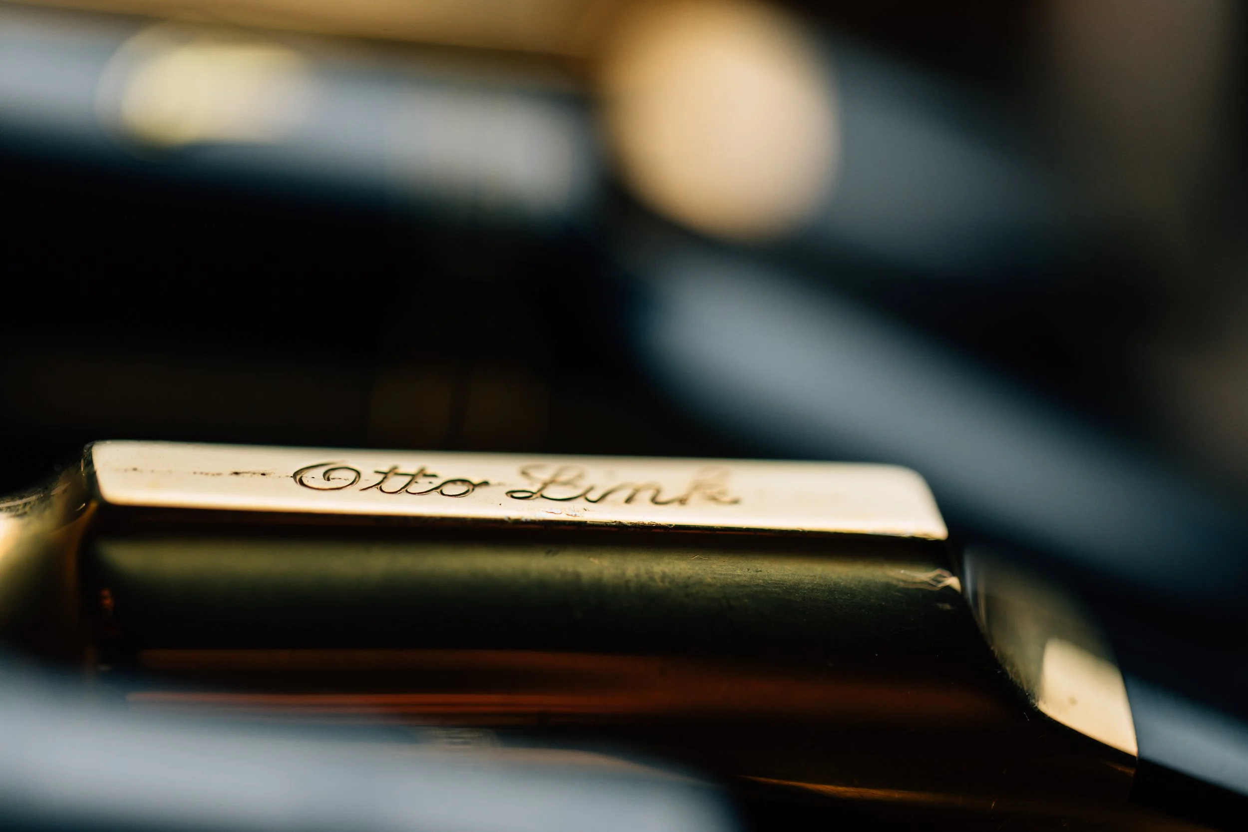 Close-up of an Otto Link Florida V Super Tone Master saxophone mouthpiece, showcasing its iconic gold finish and engraved branding.