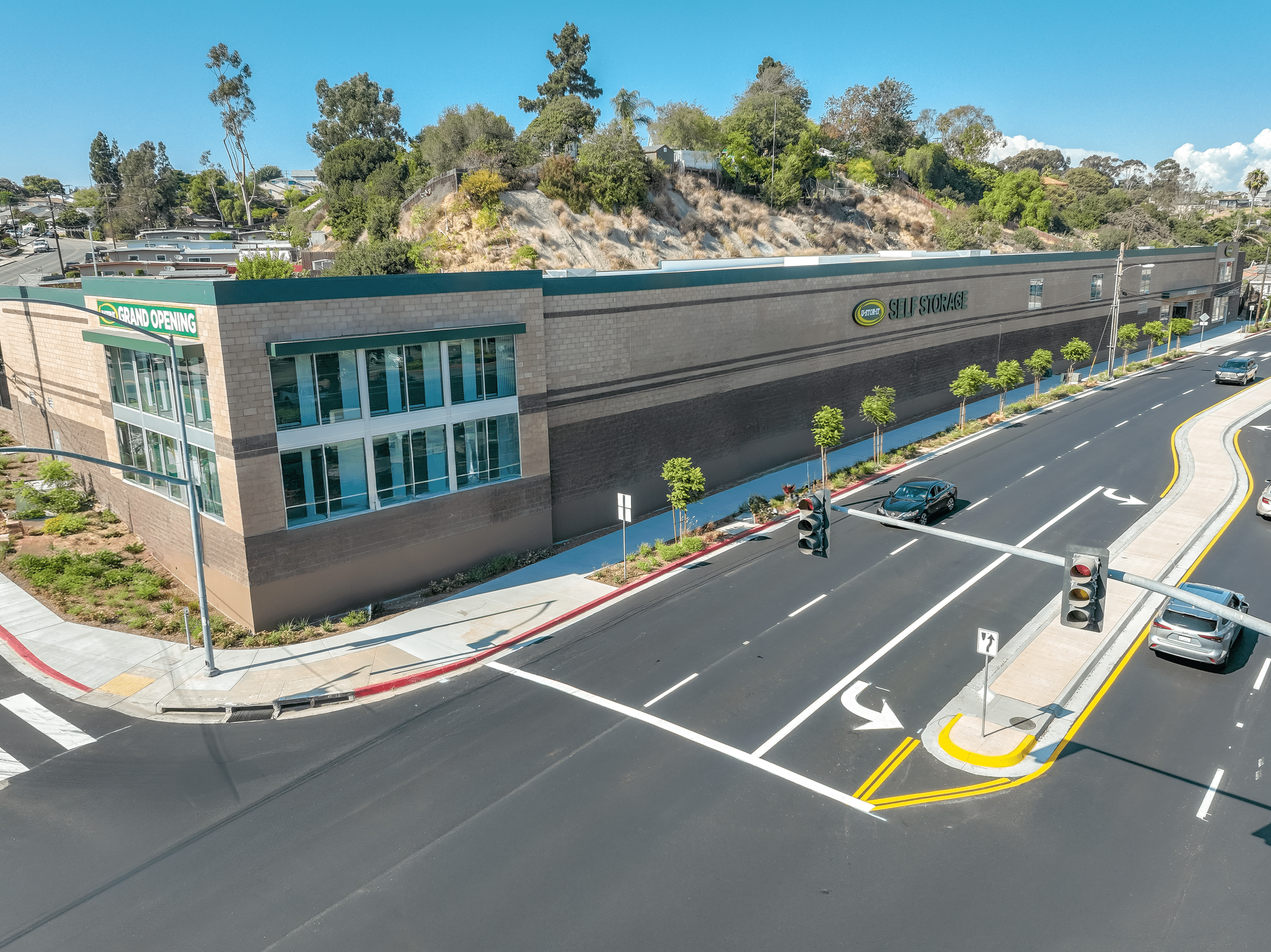 U-Stor-It City Heights facility with clouds and cars parked on the street