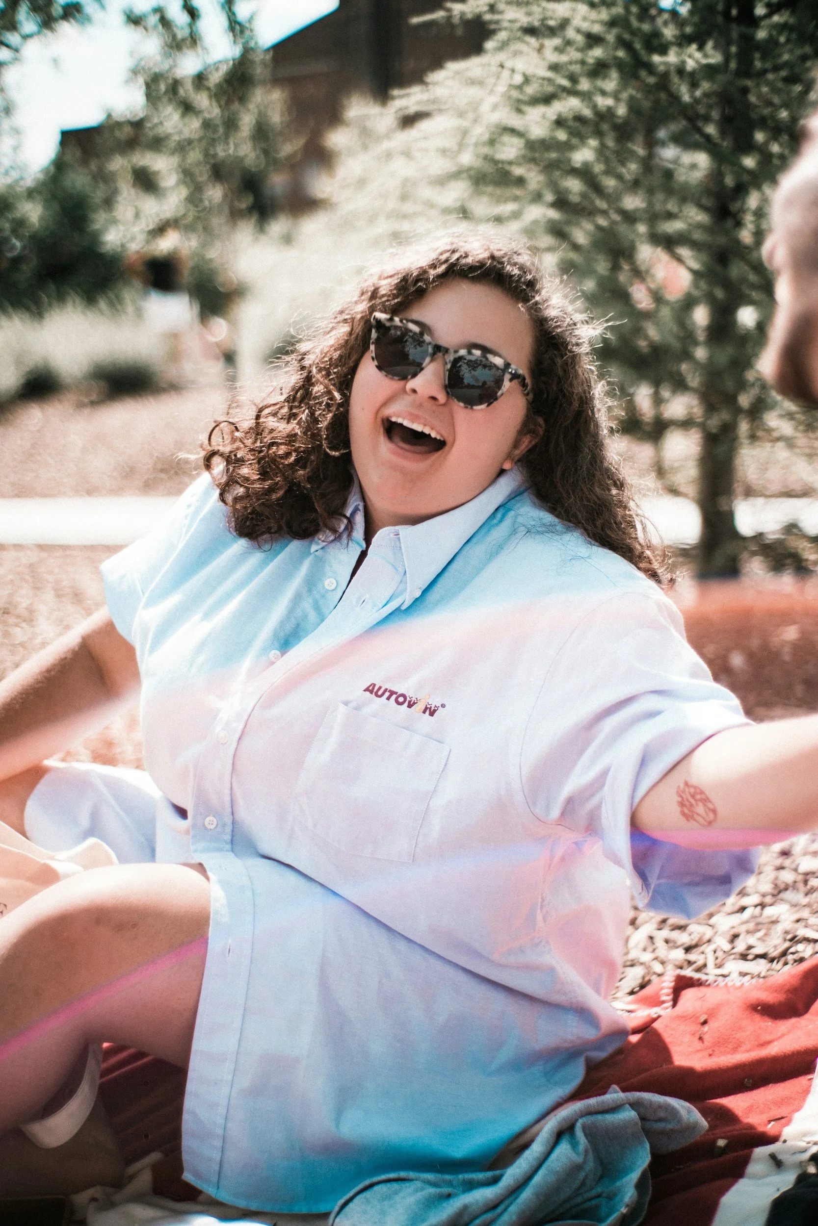 woman sitting smiling for putting herself first
