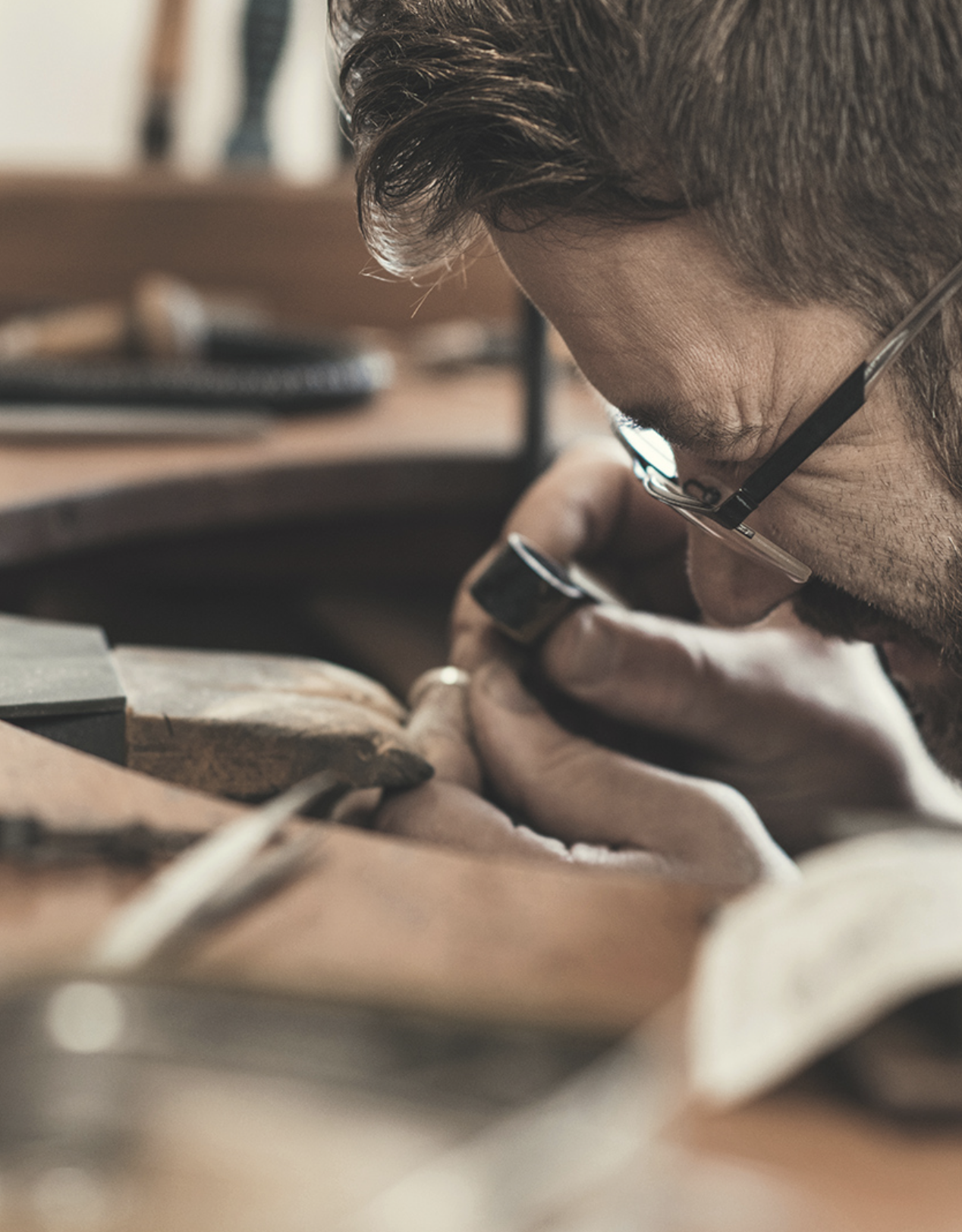 Jeweler examining an item with a loupe