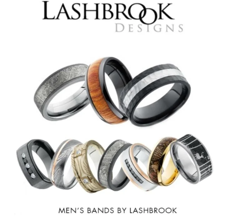 Variety of men's rings by Lashbrook Designs with diverse materials and styles.