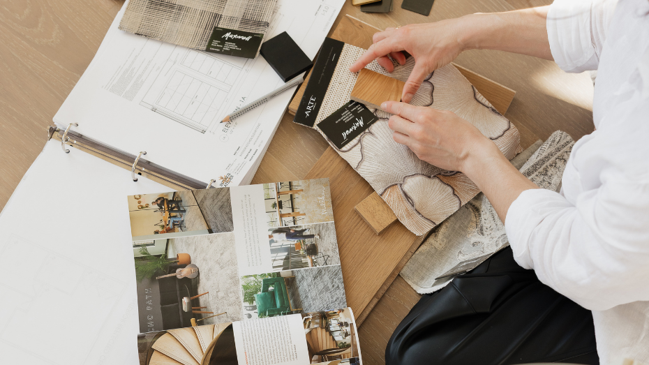 A  muskoka lakes interior designer looking at design samples