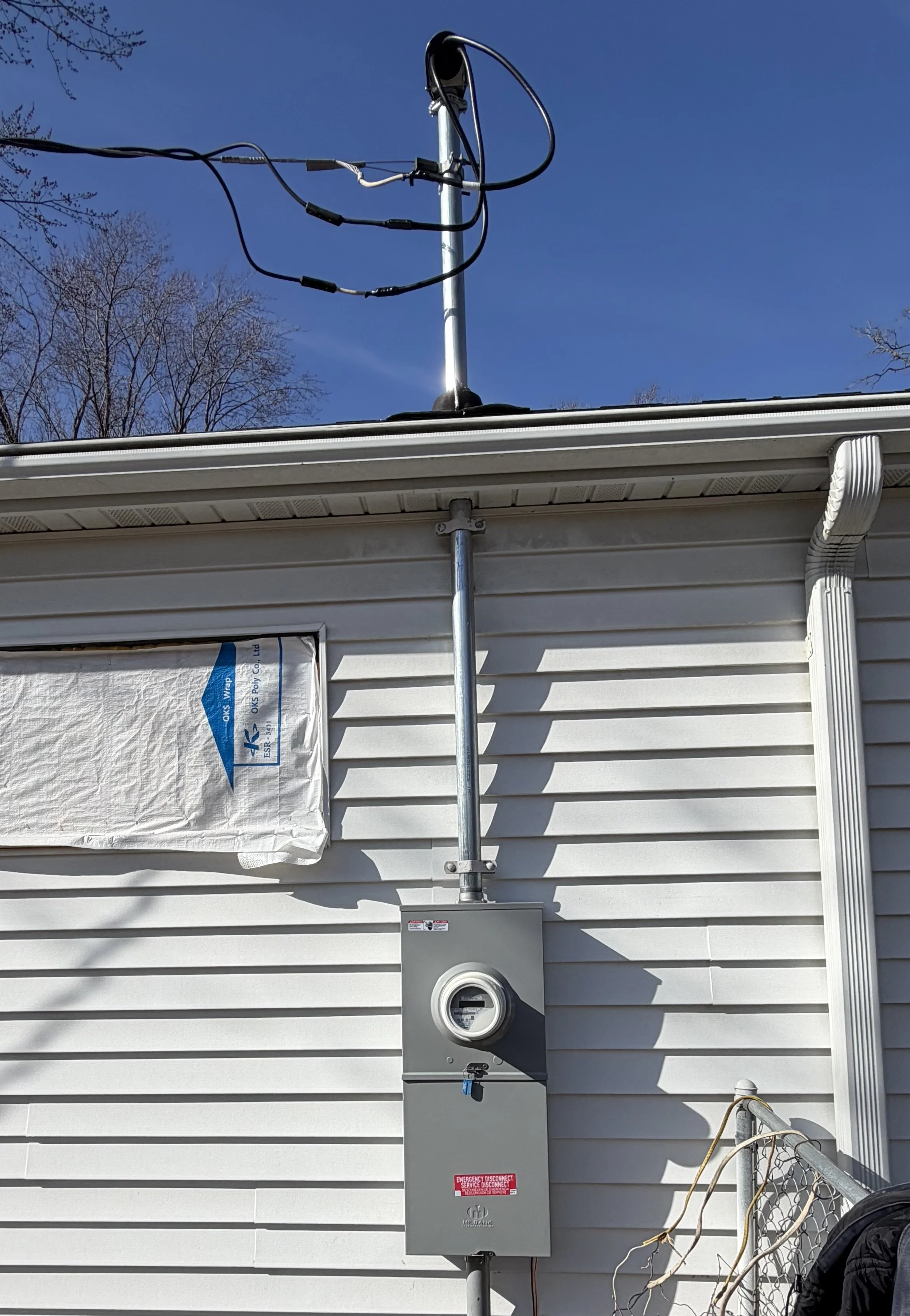 Storm damage meter mast repair Minneapolis MN master electrician JM Robinson Electric