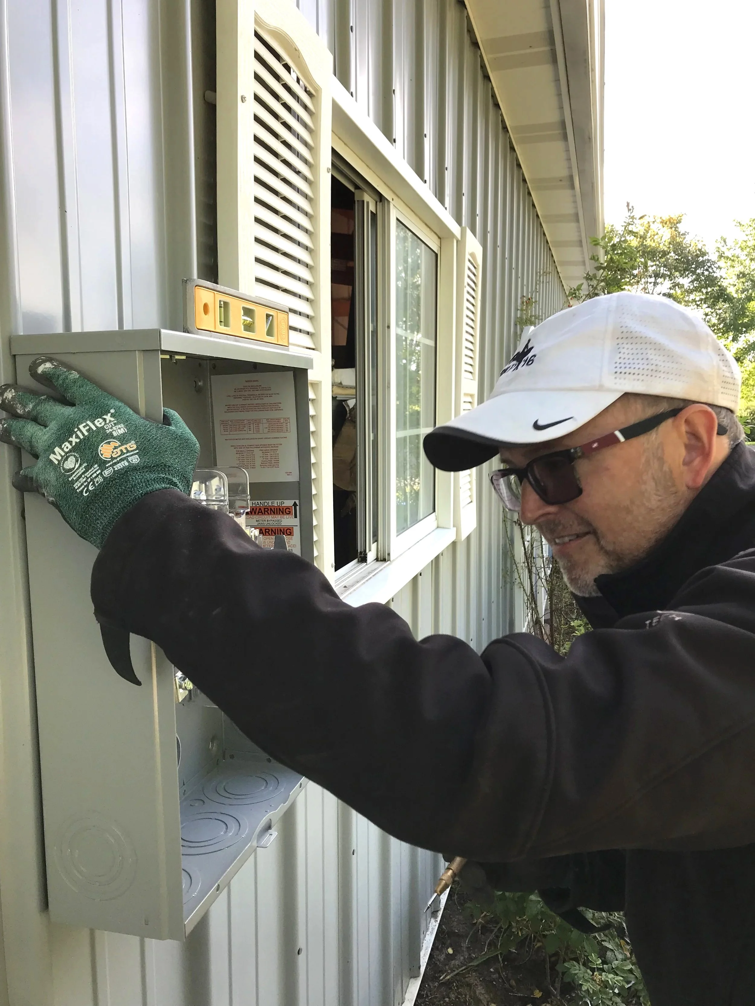Jeff Robinson master electrician installing sub panel Minneapolis western suburbs Minnesota