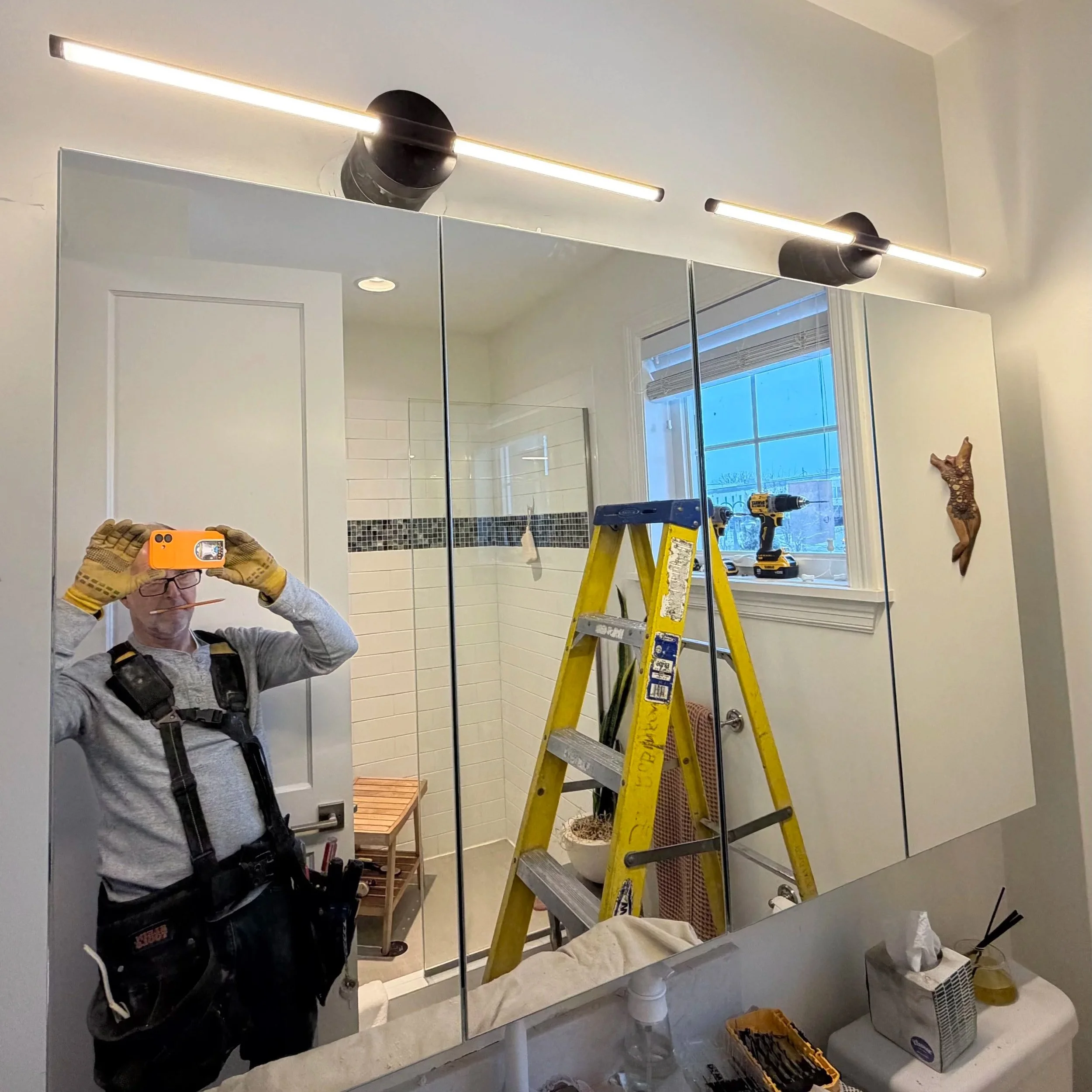 Jeff installing vanity lights in a bathroom remodel Maple Plain