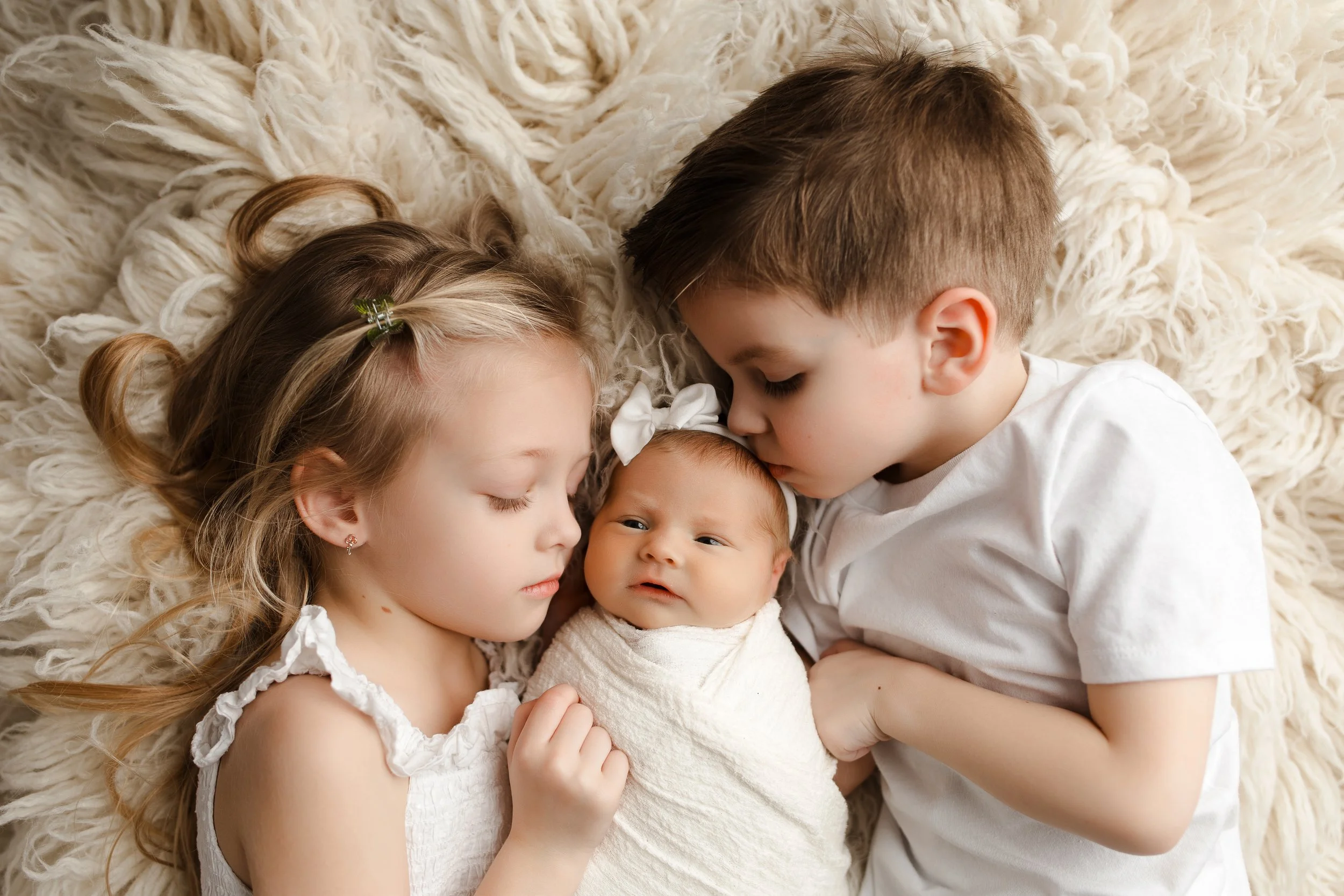 Family holding newborn in studio — Alana Mae Photography in SWLA