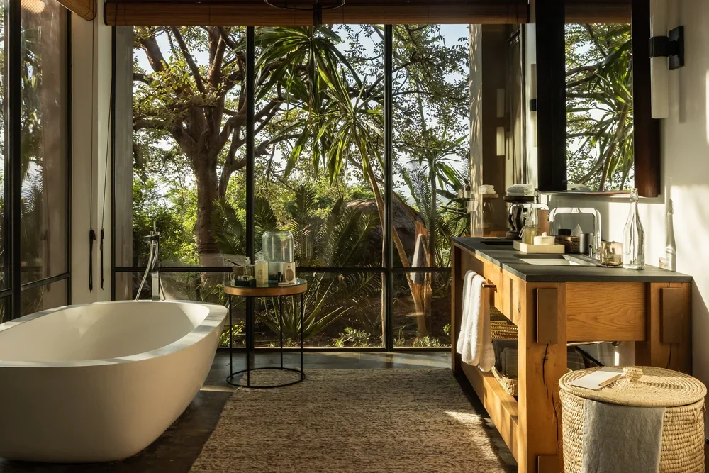 Singita+Kilima_Main+Suite+Bathroom+1.webp