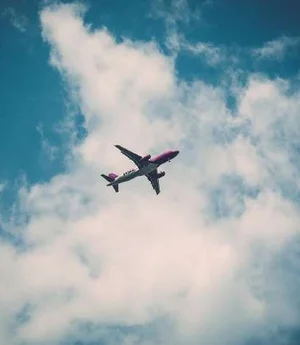 An aircraft climbing through cloud