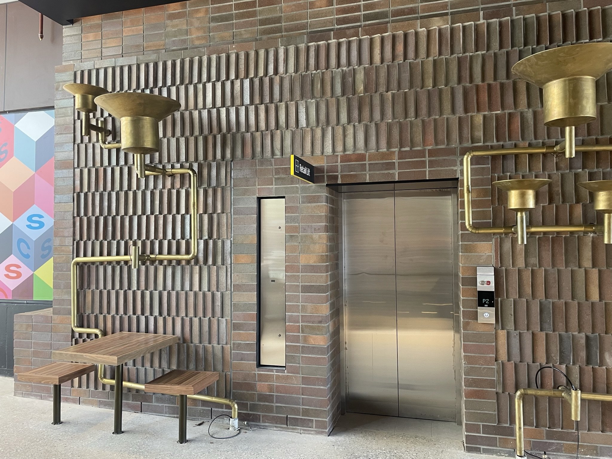 Architectural face brick wall completed by Fugen Masonry at South City Square Brickworks, Queensland, showcasing premium commercial brickwork and feature masonry detailing.