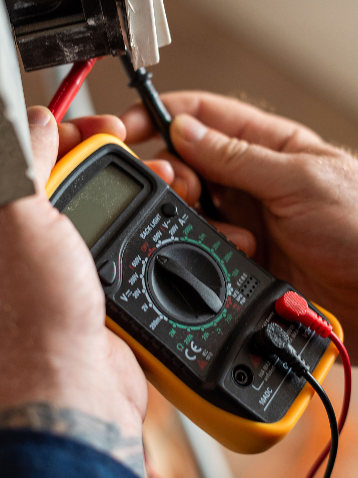 Electrician Using a Multimeter