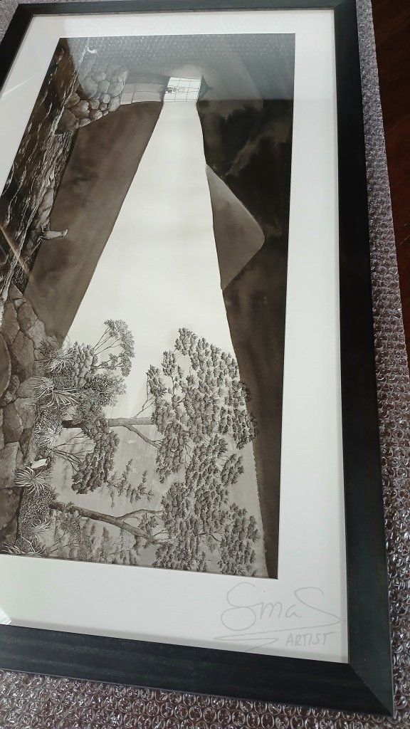 Framed ink drawing titled "The Lighthouse" by New Zealand artist Sina Sibler, featuring a Fiordland crested penguin and fur seal illuminated by a lighthouse beam.