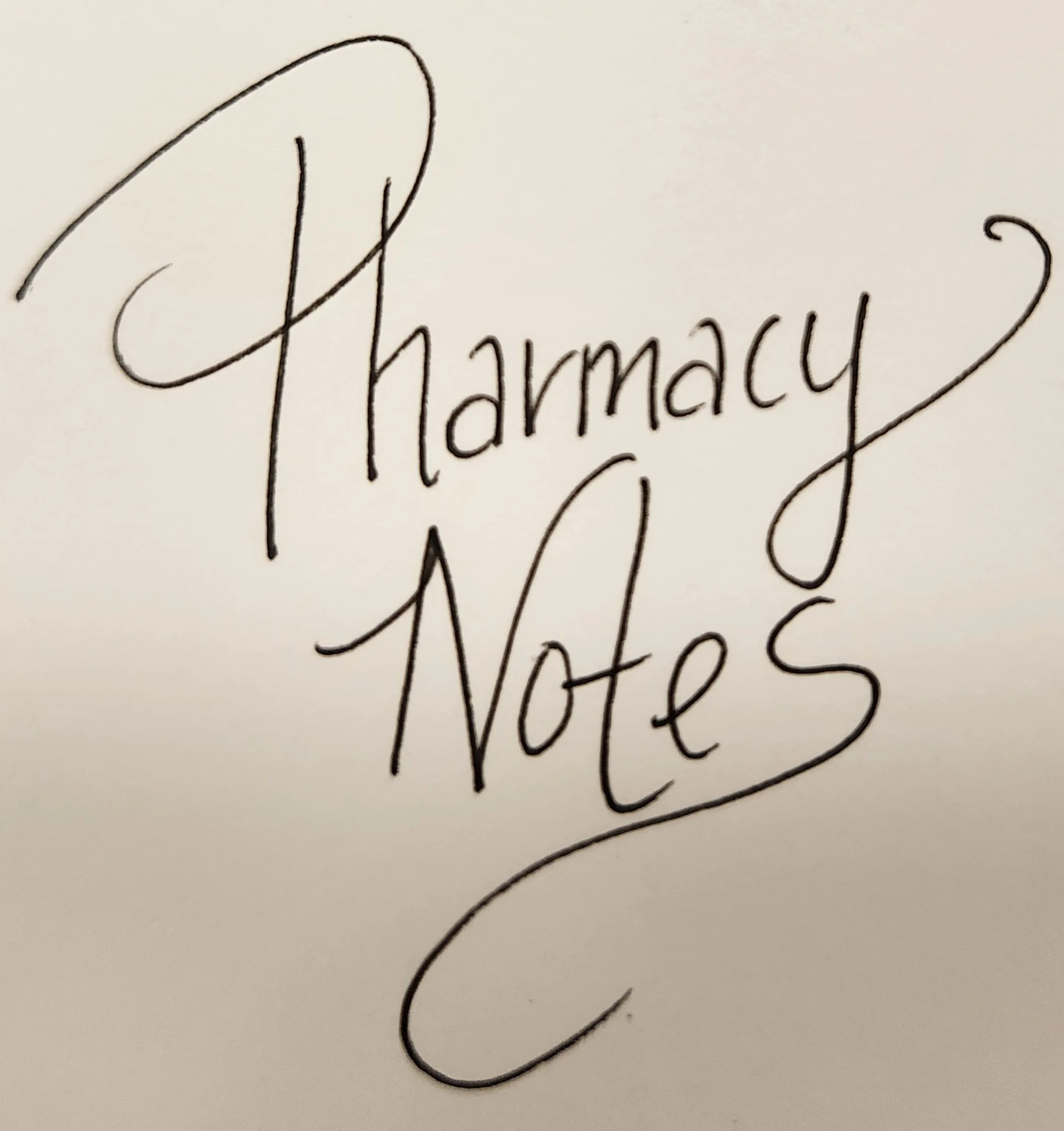 Handwritten words 'Pharmacy Notes' on white paper in cursive style.