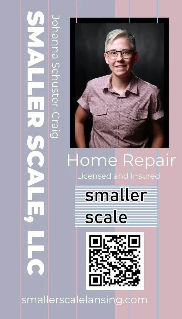 Business card for Smaller Scale, a home repair service. The card features a portrait of Johanna Shuster-Craig, the business owner, with short gray hair and glasses, wearing a pink checkered shirt. The card states the service is licensed and insured, and highlights the availability of a smaller scale. There is a QR code at the bottom and the website smaller-scale-lansing.com.