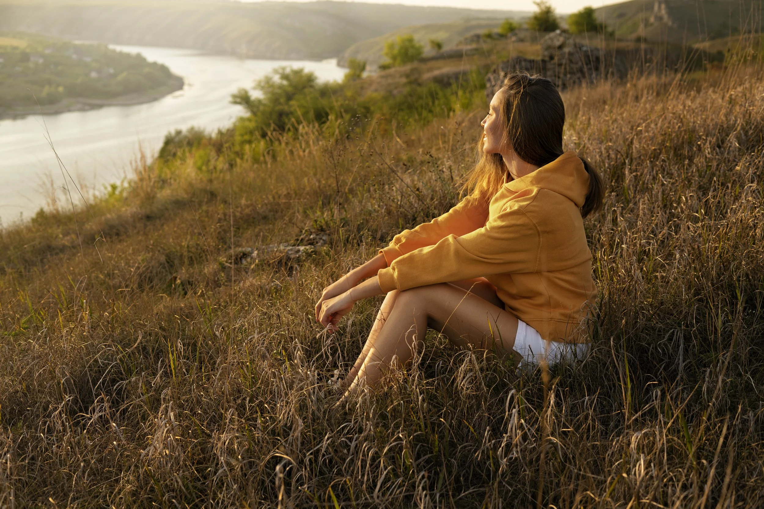 side-view-woman-sitting-outdoors.jpg
