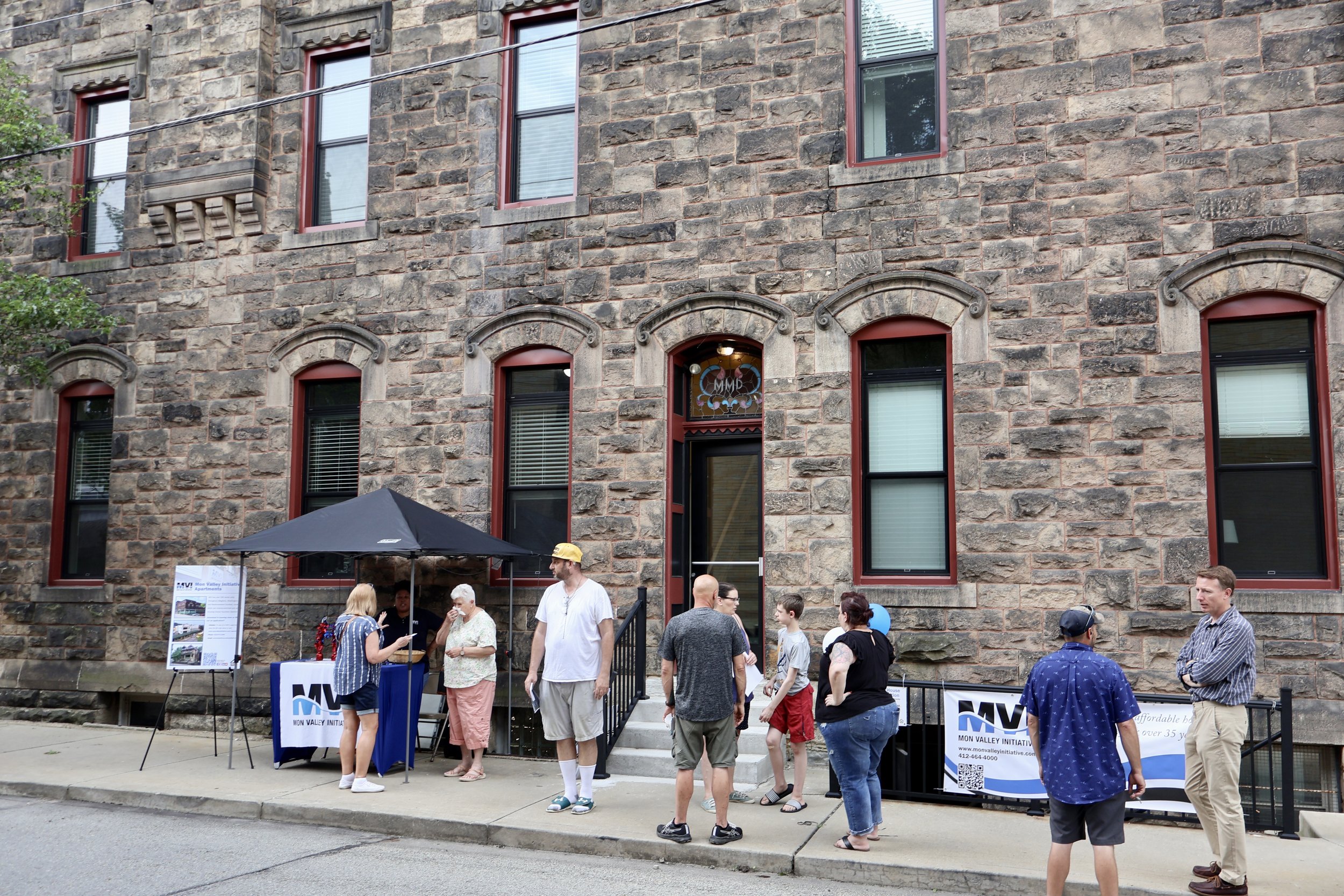 Attendees gather to tour the apartments and learn more about MVI programming.