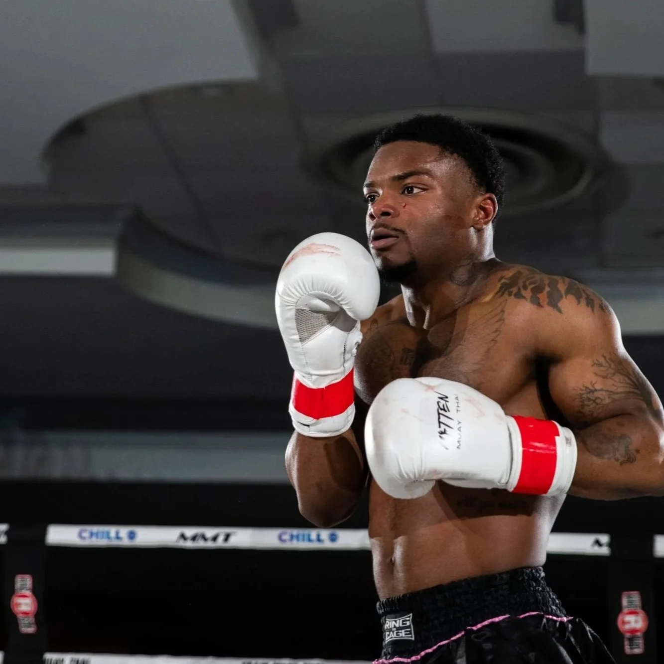 Coach Xavier Spann in the ring at an MMT fight night