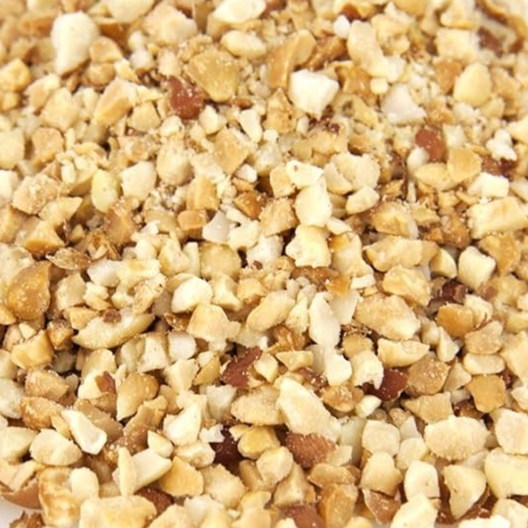 Close-up of chopped nuts, including hazelnuts and possibly almonds, on a surface.