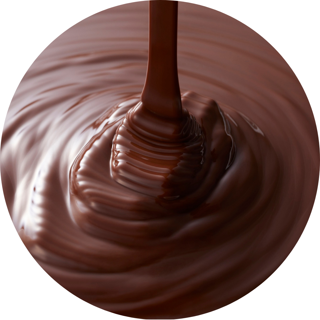 Close-up of melted chocolate being poured, creating ripples and a smooth, glossy surface.