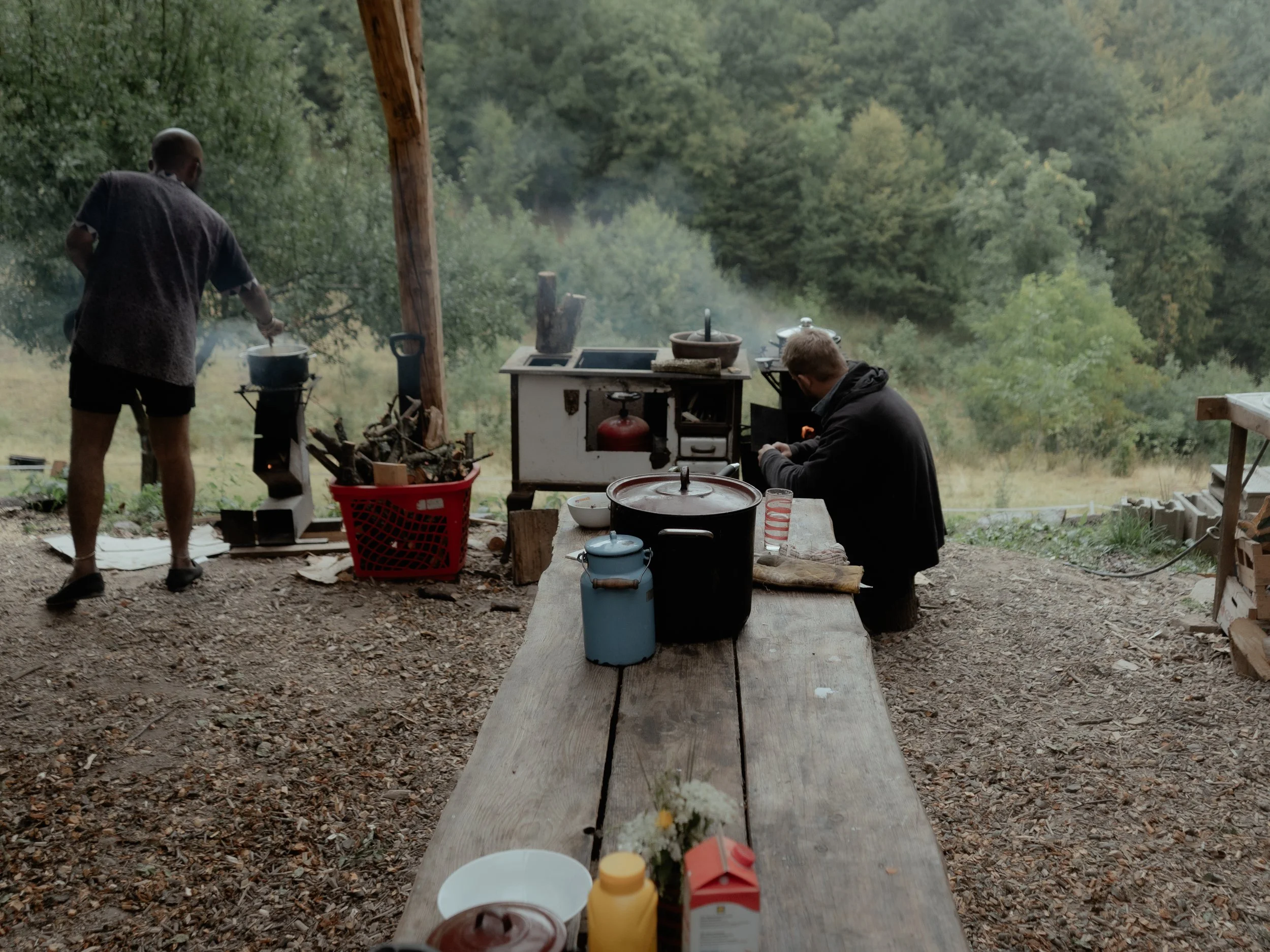 David and Varun cooking dinner in the outdoor kitchen.