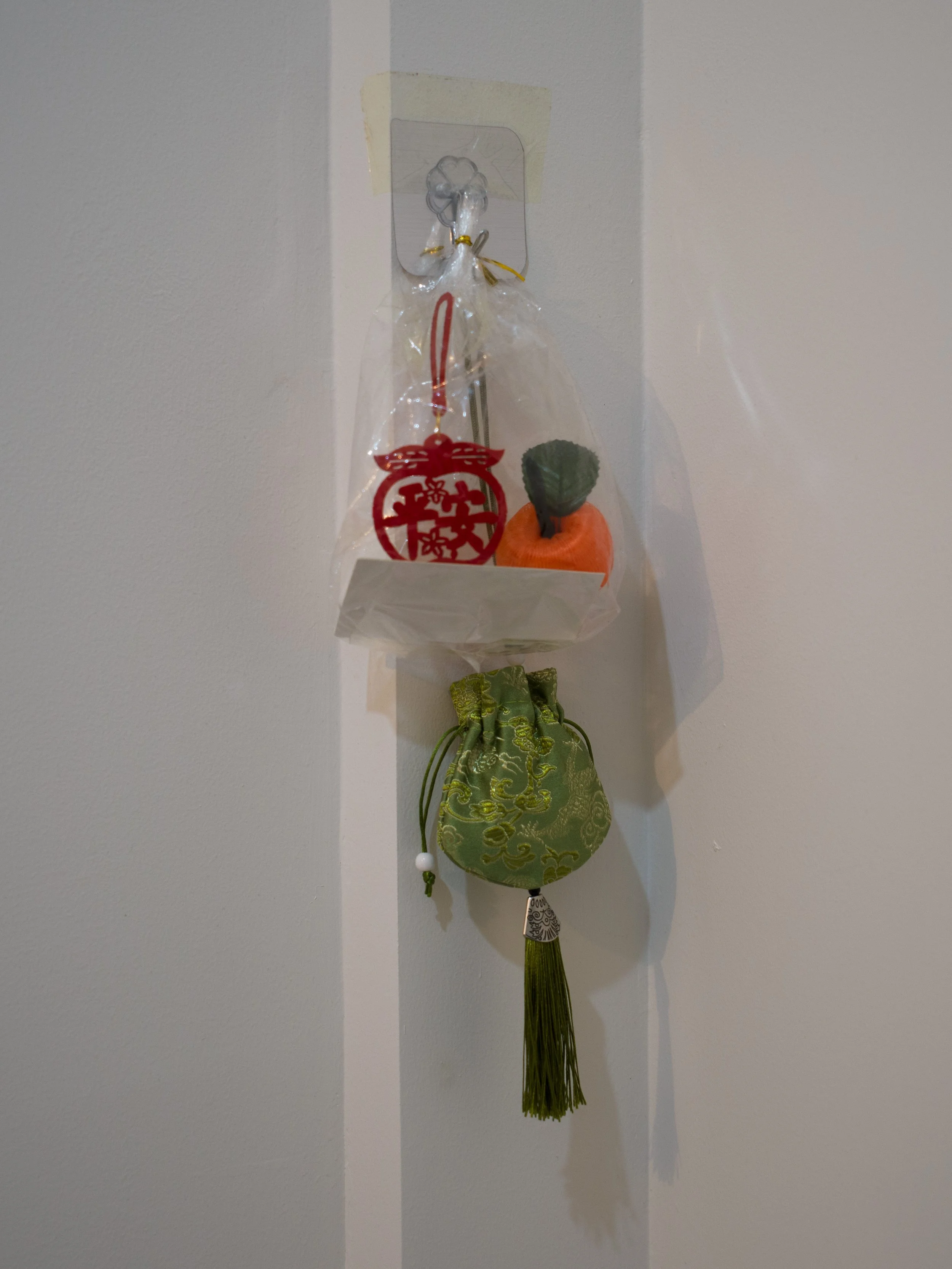 Ornaments belonging to Dorz Cheung's grandmother, with Chinese characters that read "Peace." 