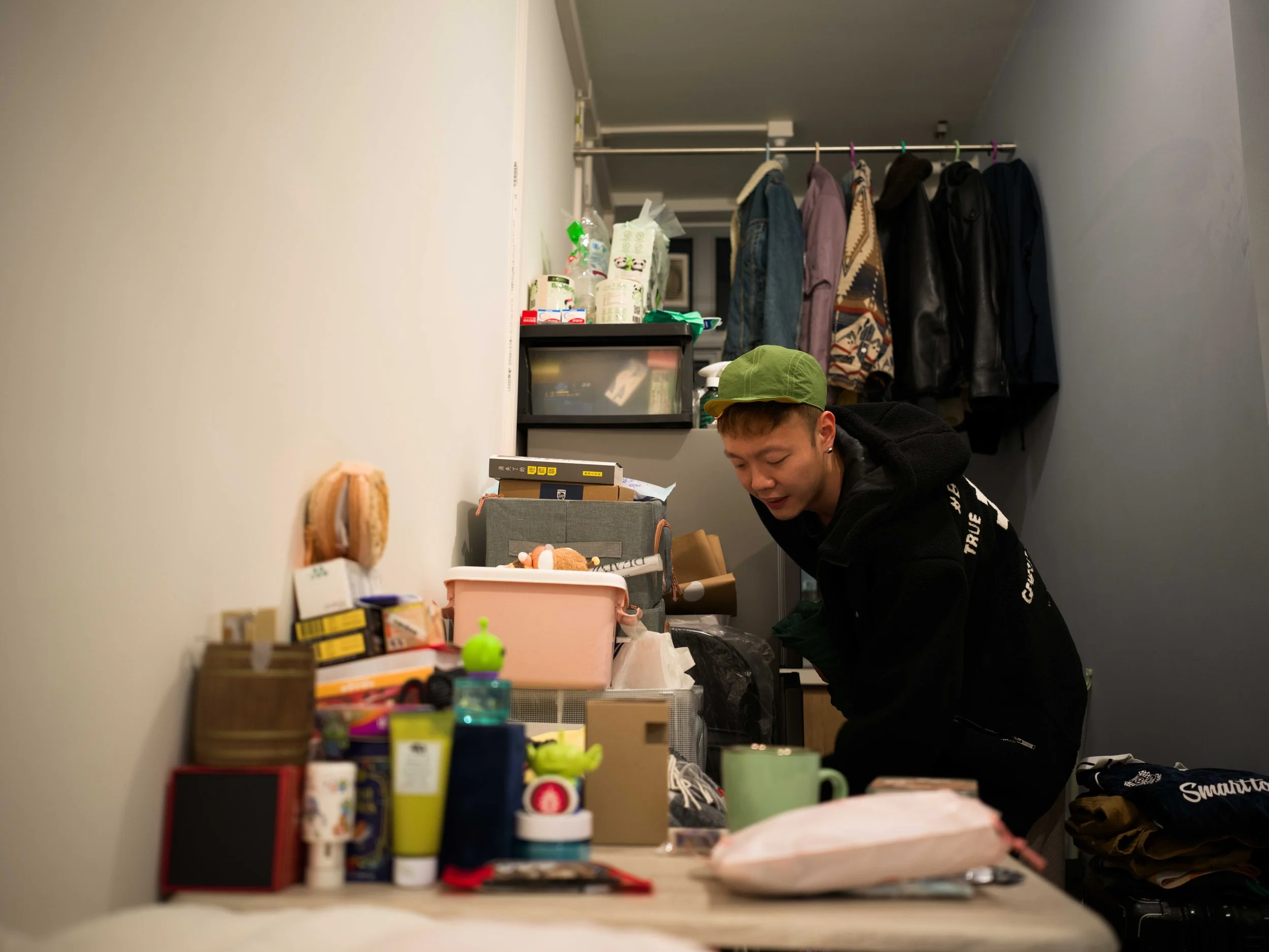 Dorz Cheung tidies his room at the temporary accommodation in Kai Tak. 