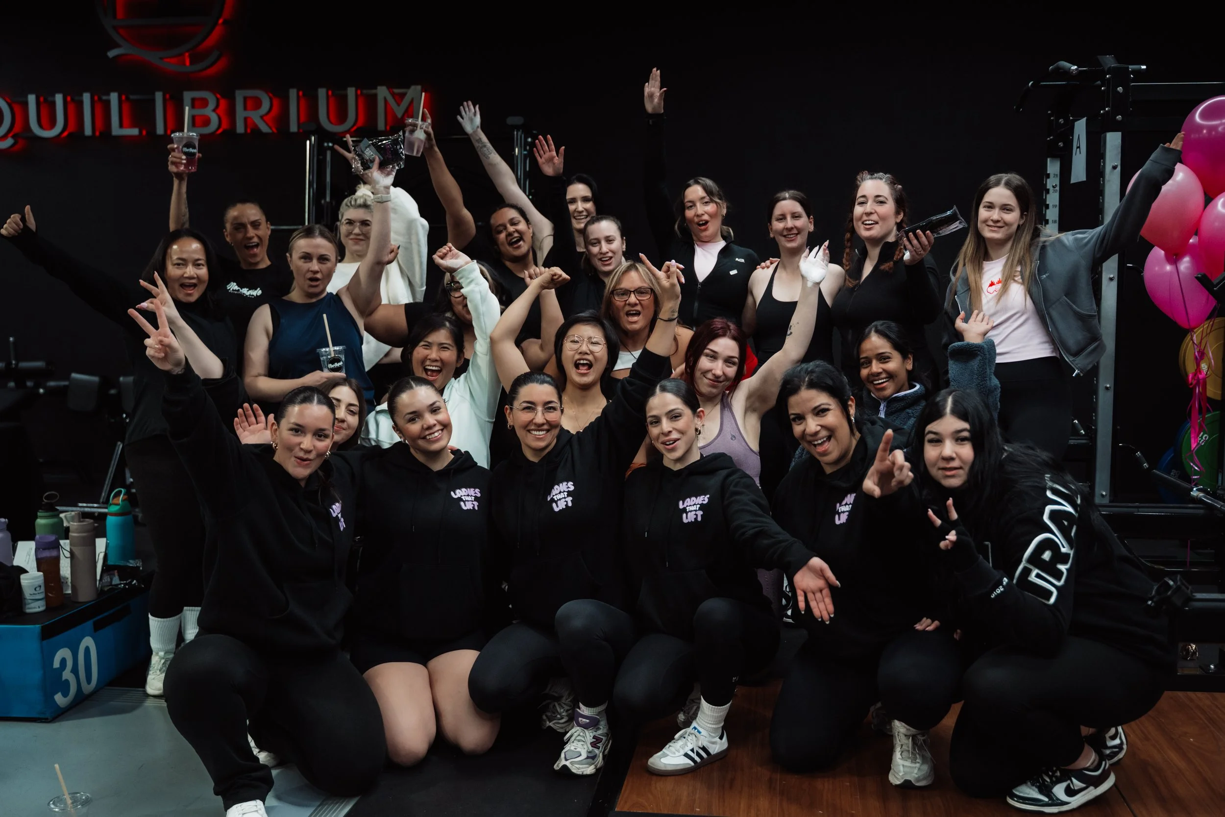 Group celebration photographed at a gym in Melbourne event