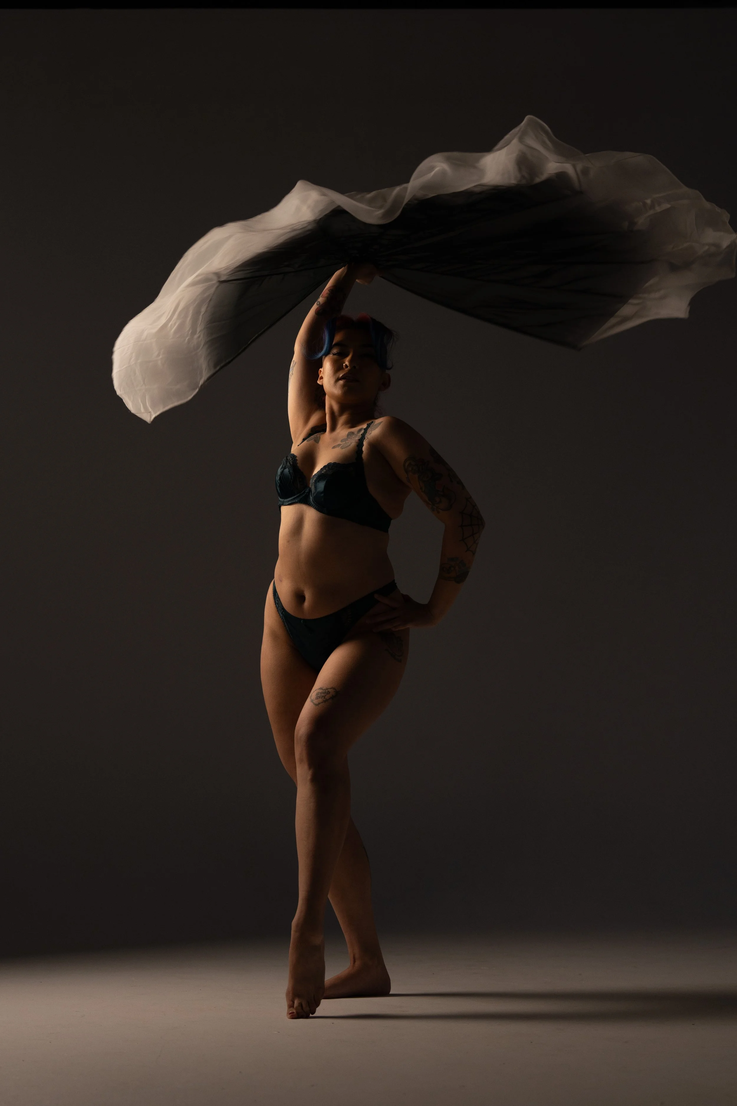 Dancer performing with flowing fabric during a creative movement photography session in Melbourne.