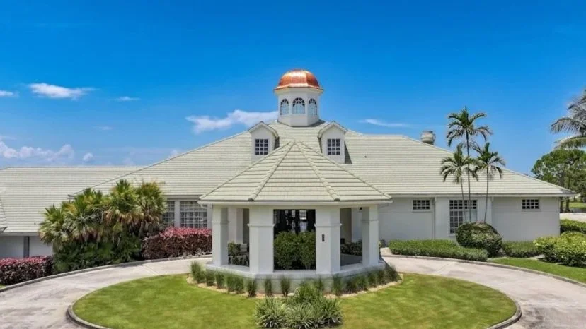 Clubhouse exterior with a copper dome at The Club at Lost Lake, a private golf club in Hobe Sound, FL.