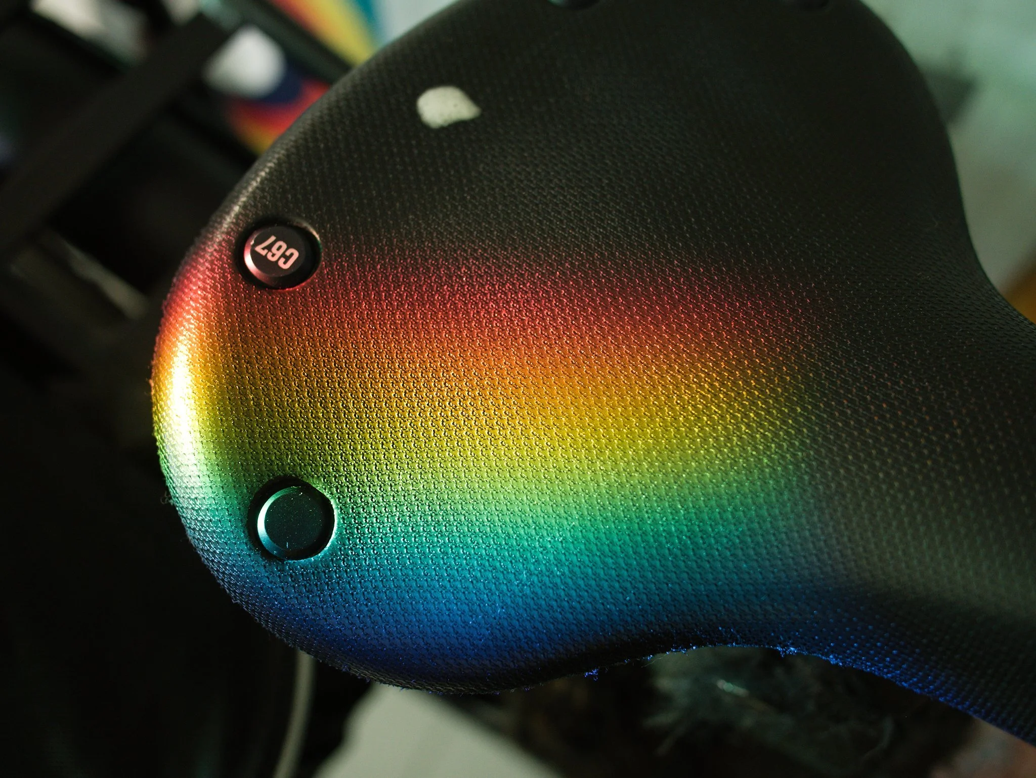 A rainbow prism of light refracting on top of a Brooks C67 bike seat in the studio of designer Martin Pyper.