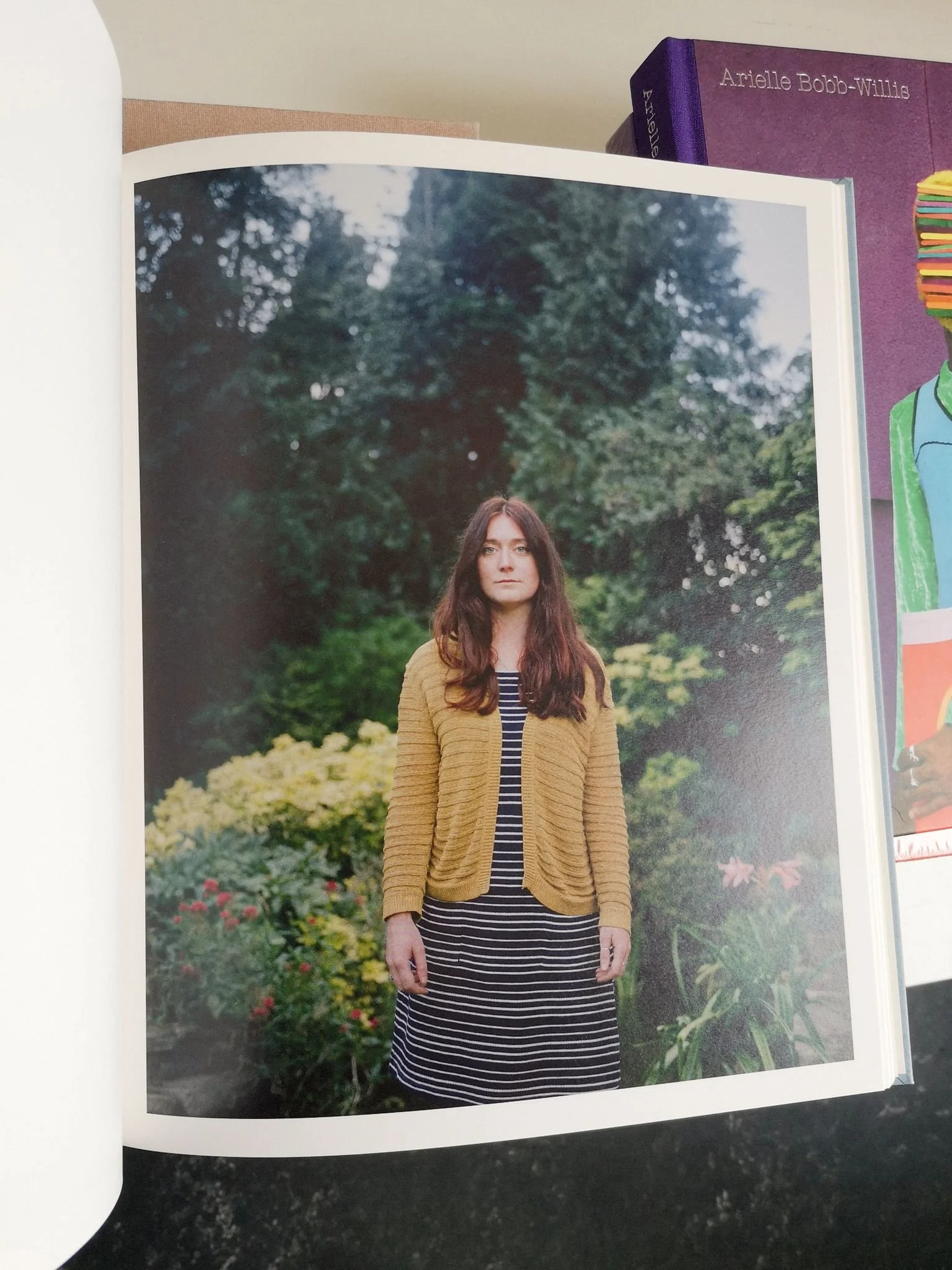Open book spread of Thomas Duffield photo book featuring his sister Rachel.