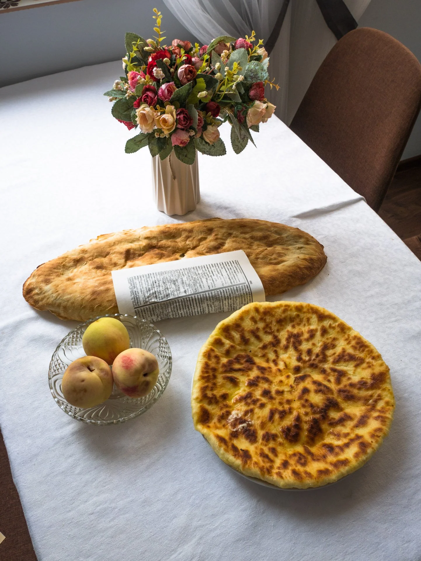 Freshly baked Georgian bread and peaches for breakfast in Tbilisi.