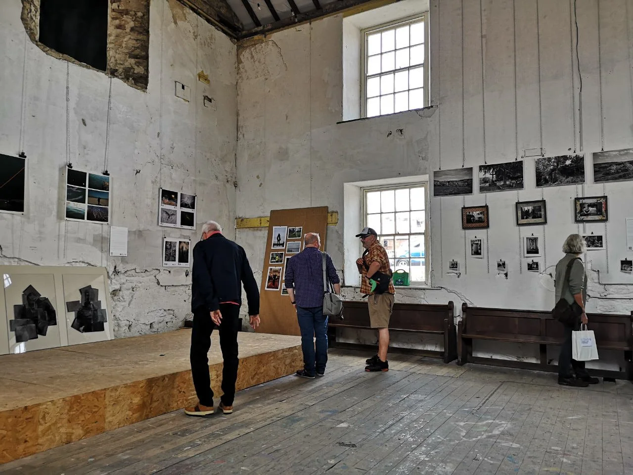 Interior view of the main exhibition room at the Parish project on Spital Street in Malton. There are different sized photo prints ranging from A5 to A2 hanging on the walls.