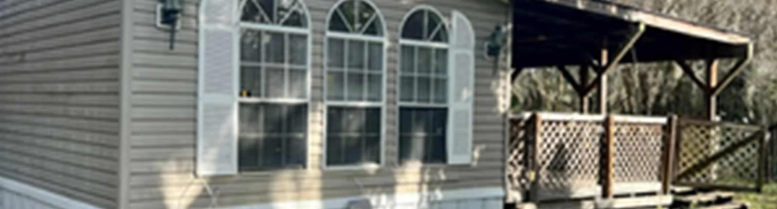 Gray ranch house with porch