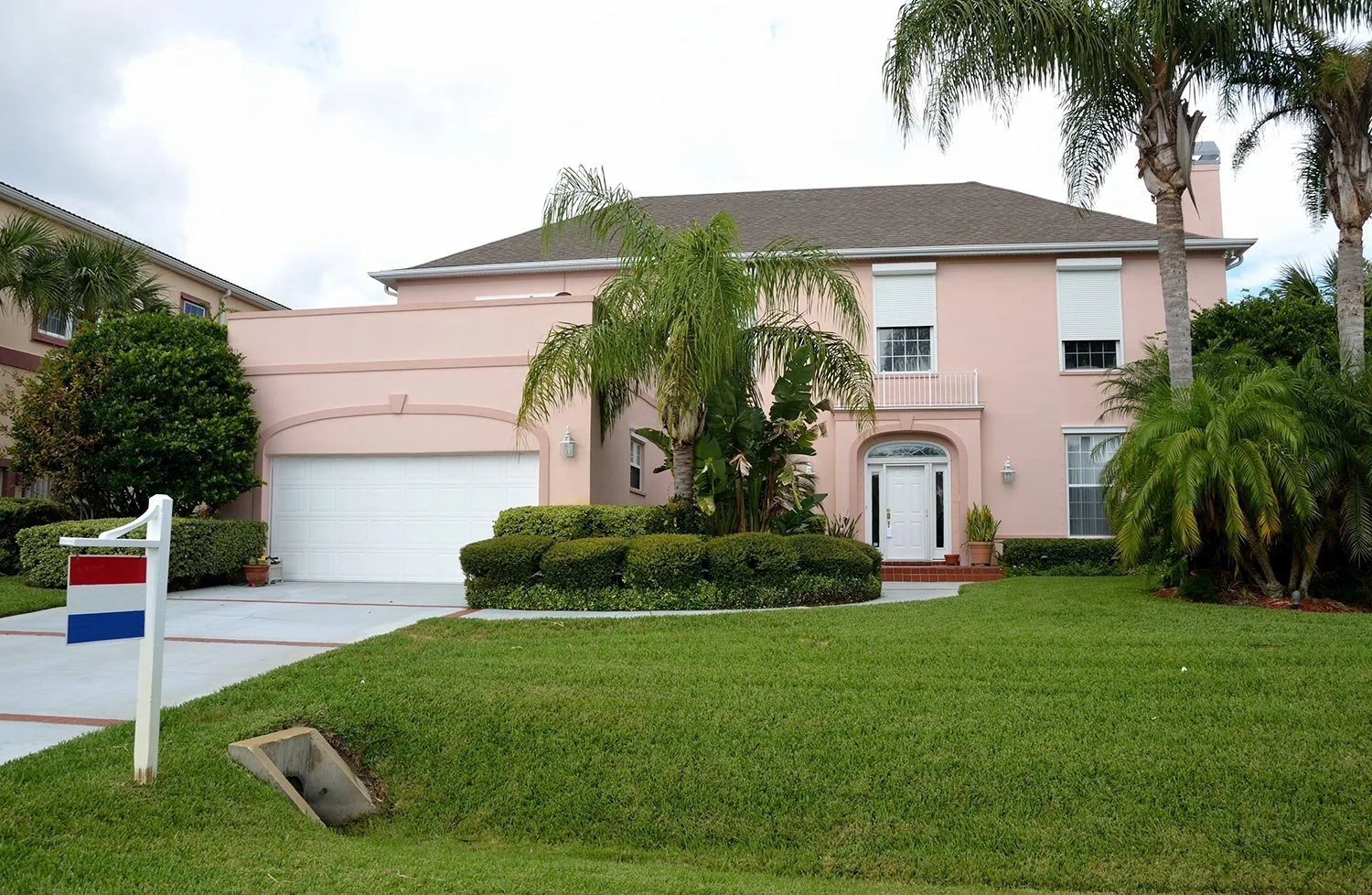 A two-story, stucco home for sale in Florida.
